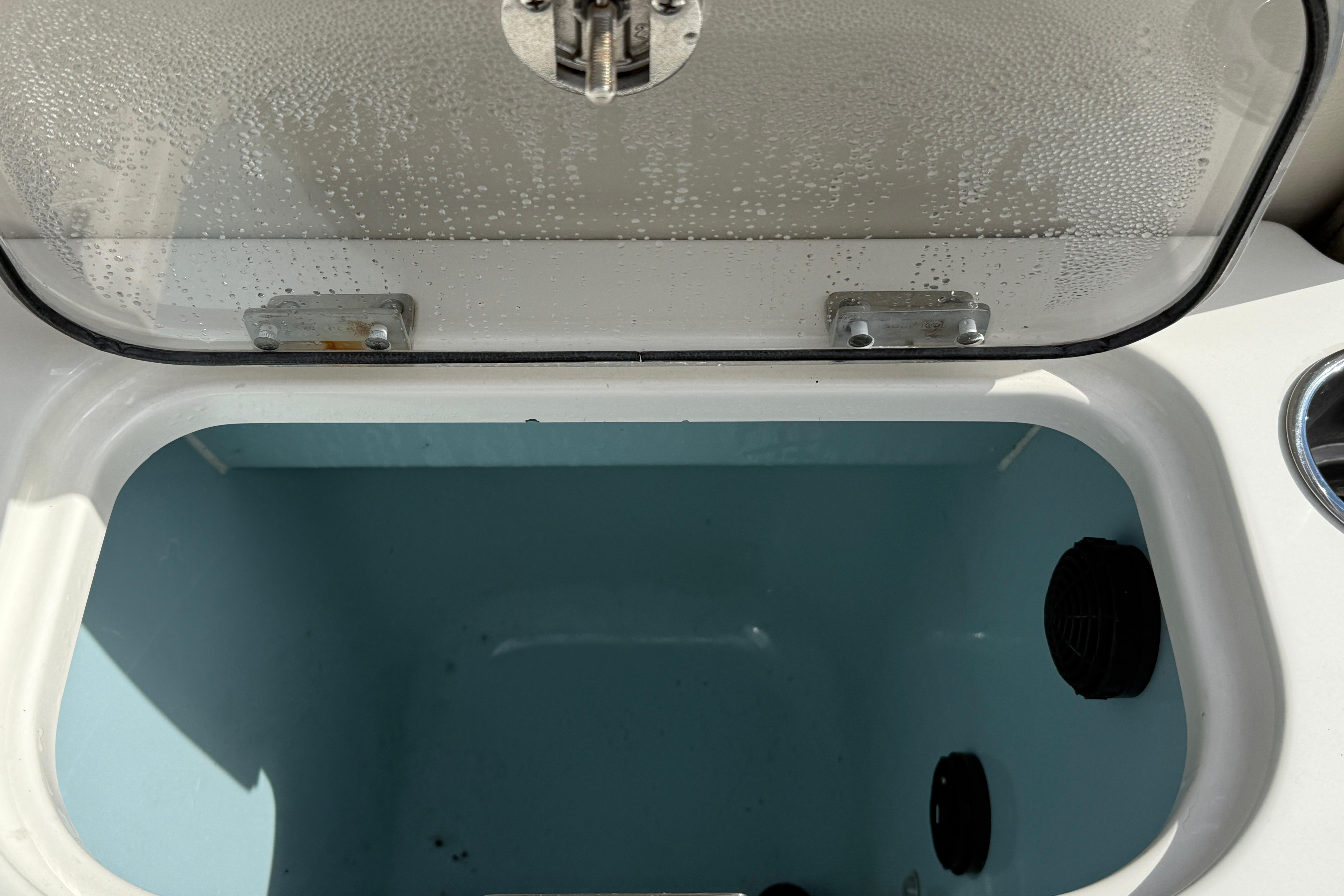 Open storage compartment on 2018 Boston Whaler 270 Dauntless boat.