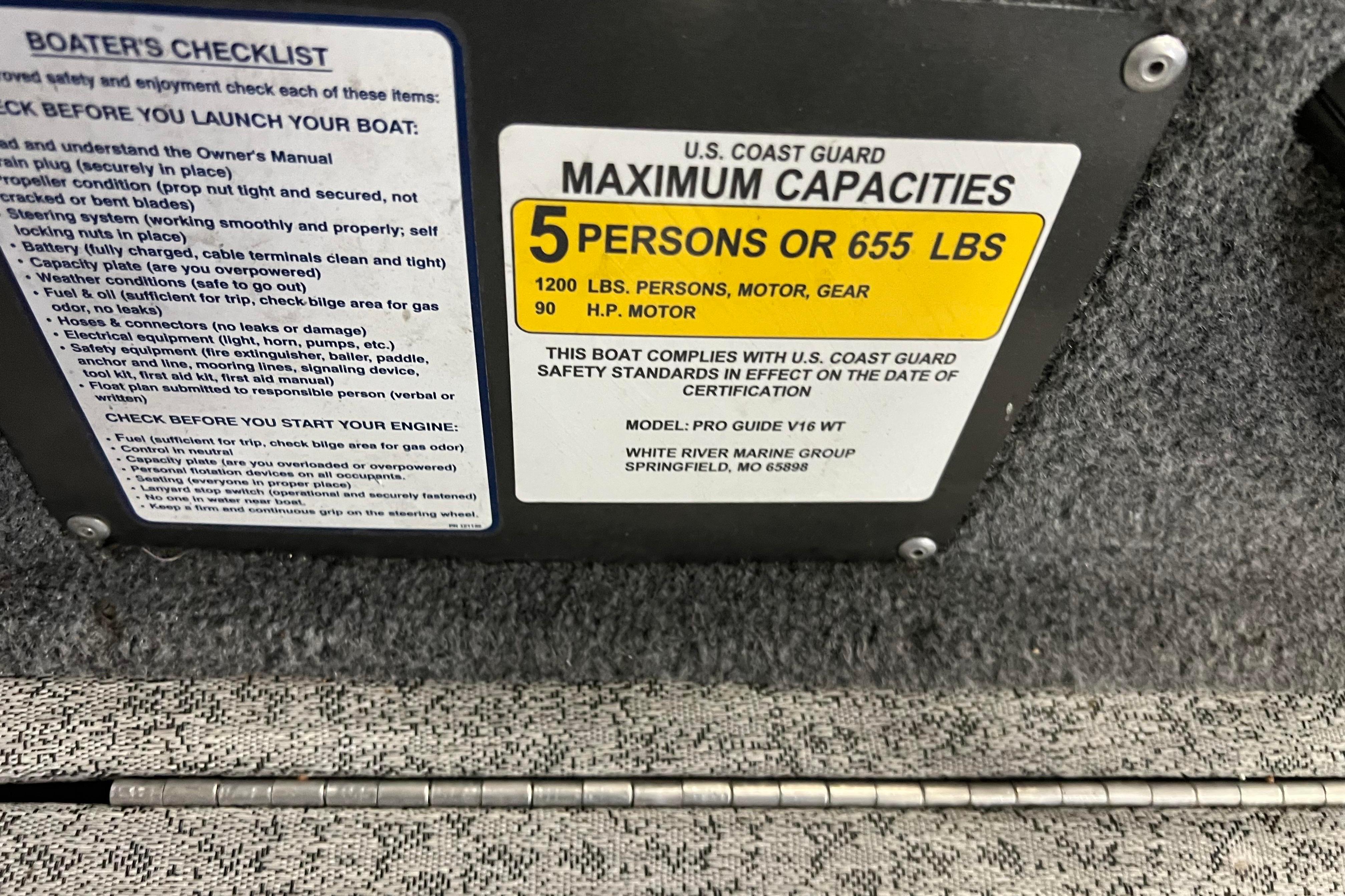 2022 Tracker Pro Guide V-16 WT capacity plate, 5 persons or 655 lbs, safety checklist.