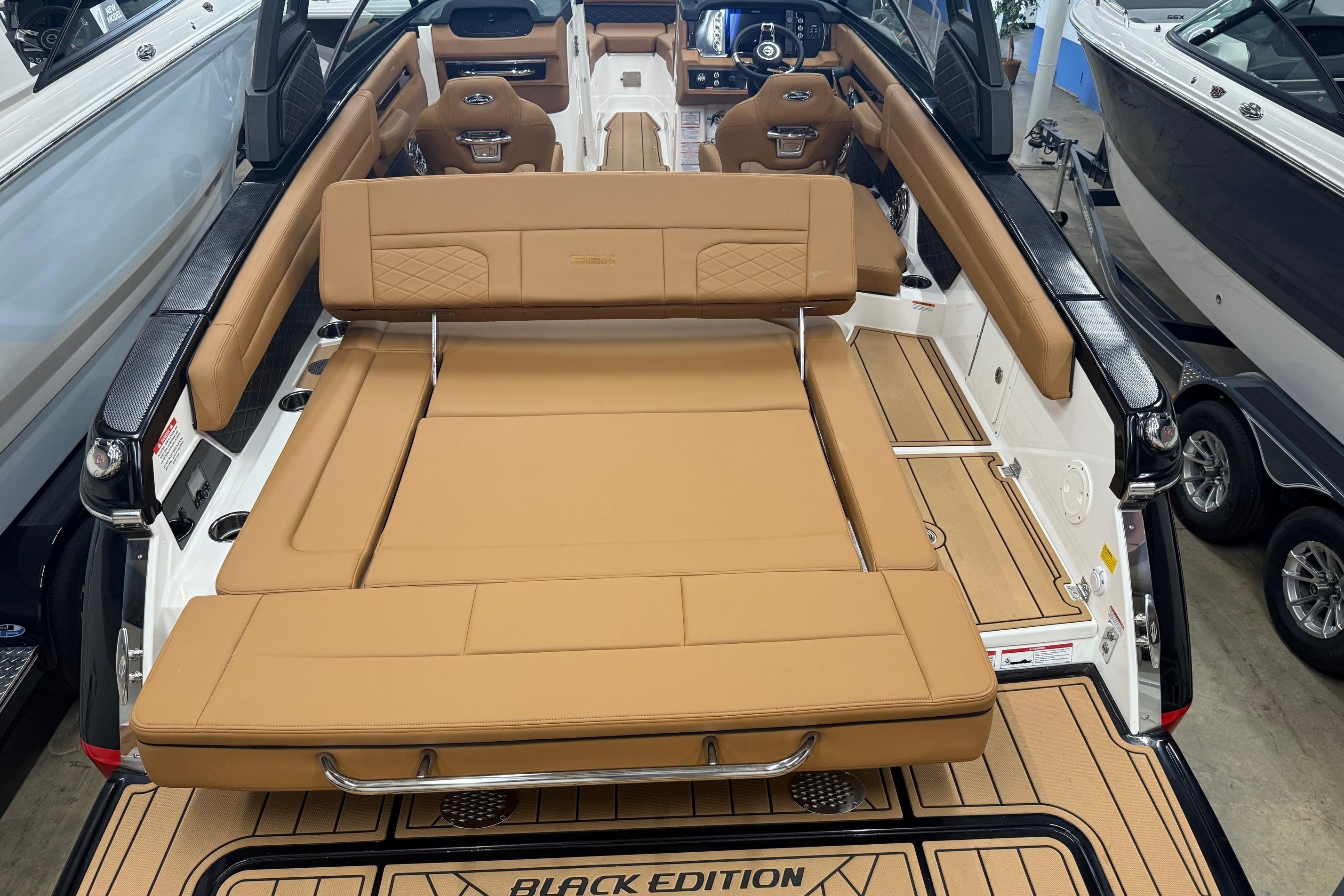 2026 Chaparral SSX 6 boat interior with tan leather seating and sleek design.