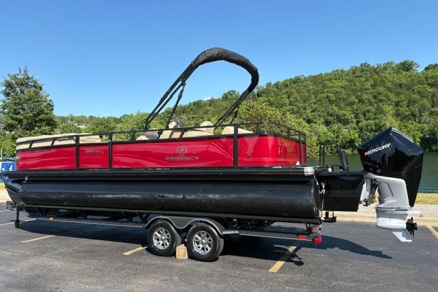 2025 Regency 250 DL3 pontoon boat on trailer, parked in sunny outdoor setting.