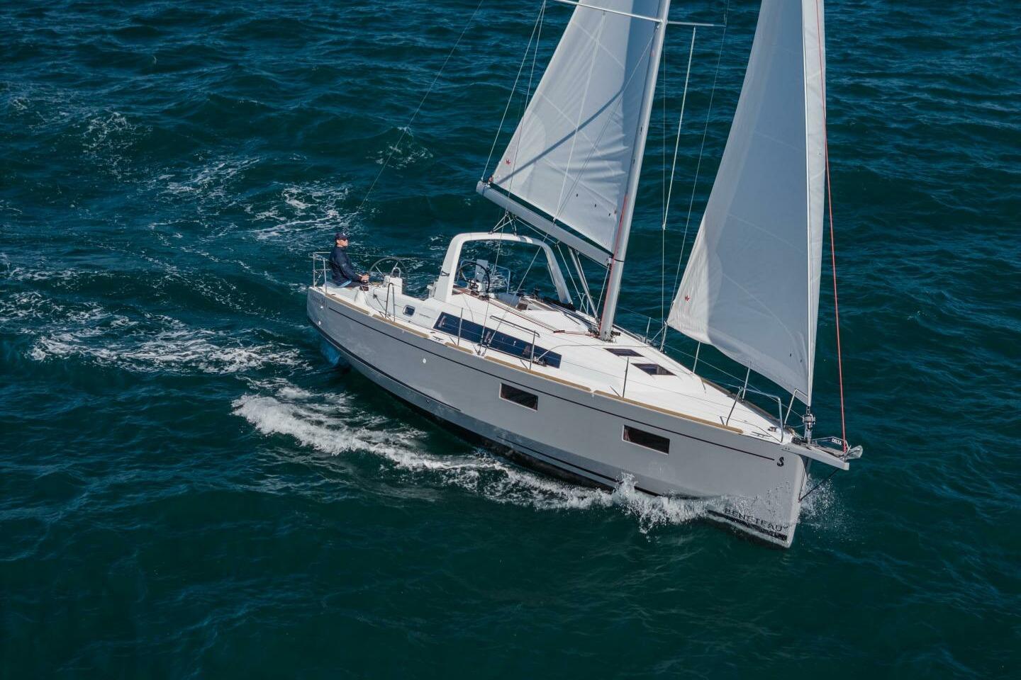 2023 Beneteau Oceanis 38.1 sailing on open water, showcasing sleek design and performance.