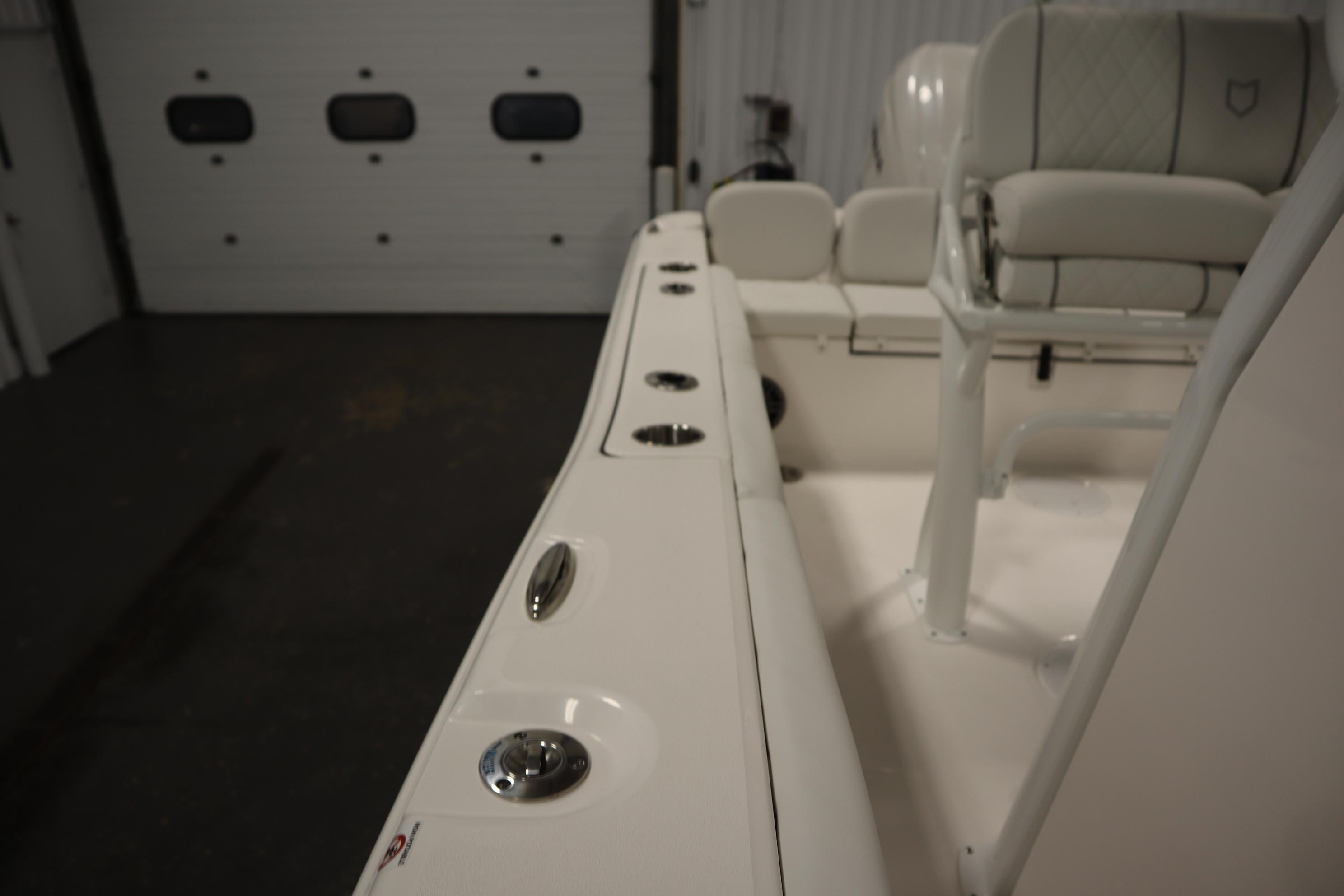 2026 Sea Fox 228 Commander boat interior with seating and rod holders.