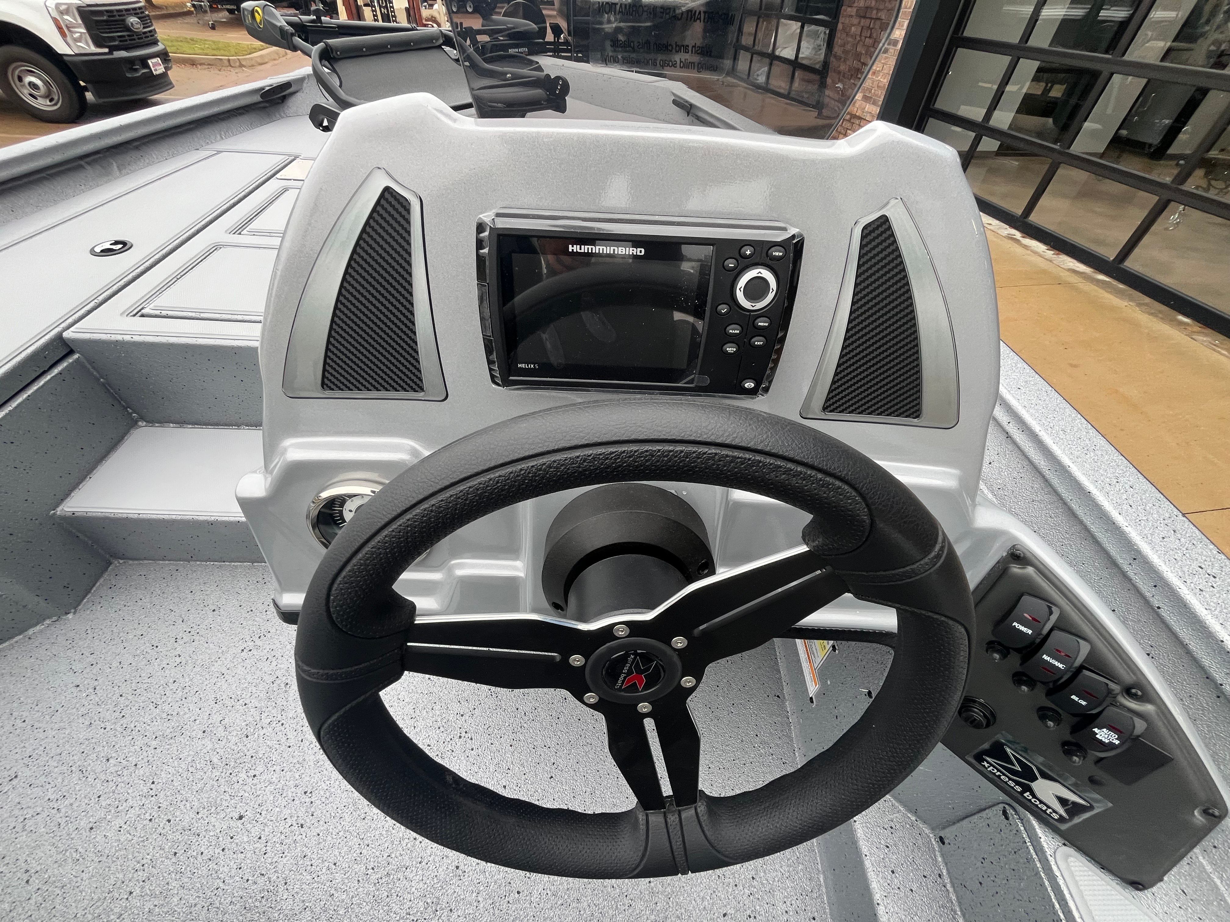 2026 Xpress H18C Crappie console with steering wheel and electronics.