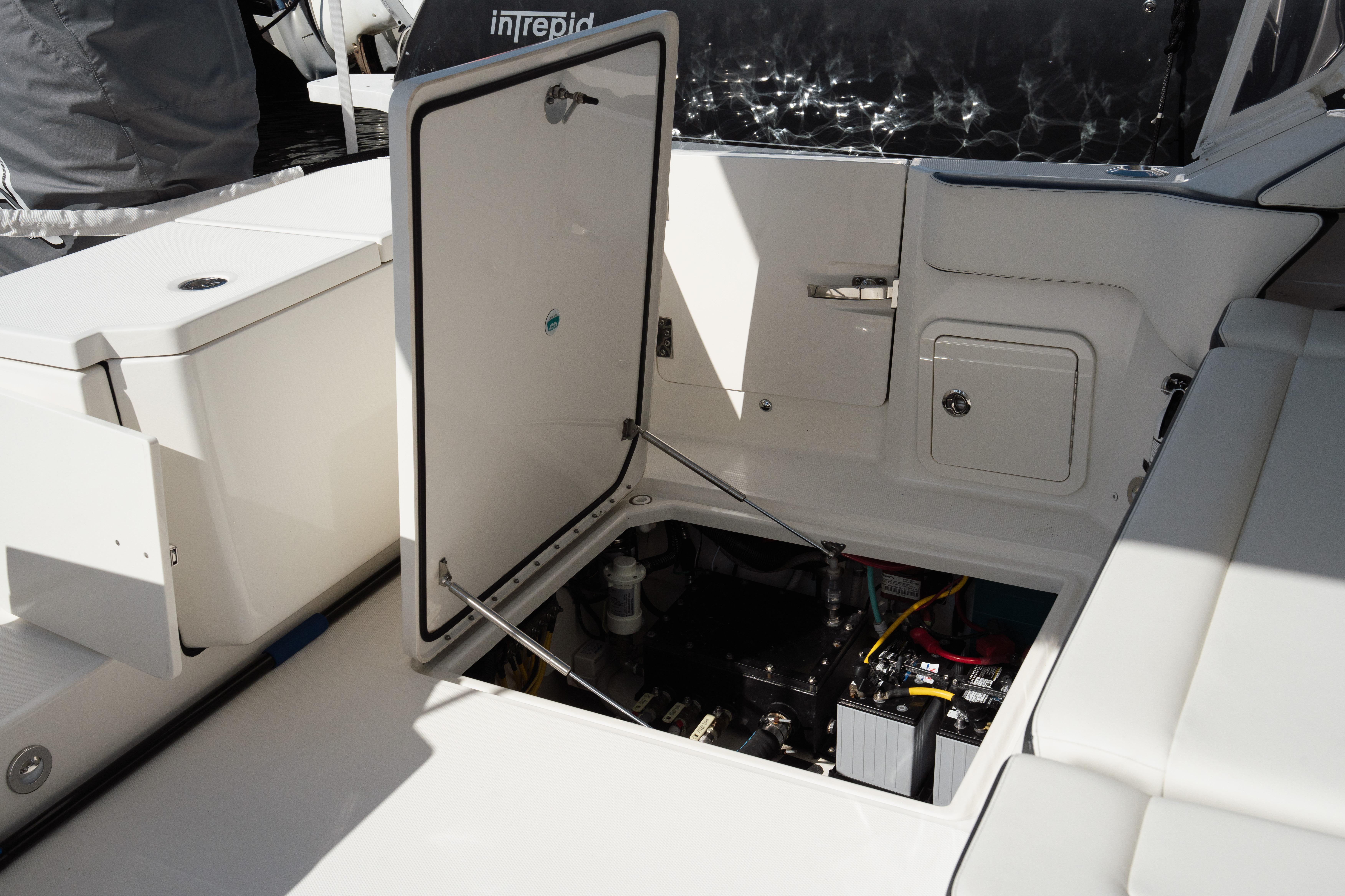 2024 World Cat 400 DC-X boat interior with open hatch revealing engine compartment.