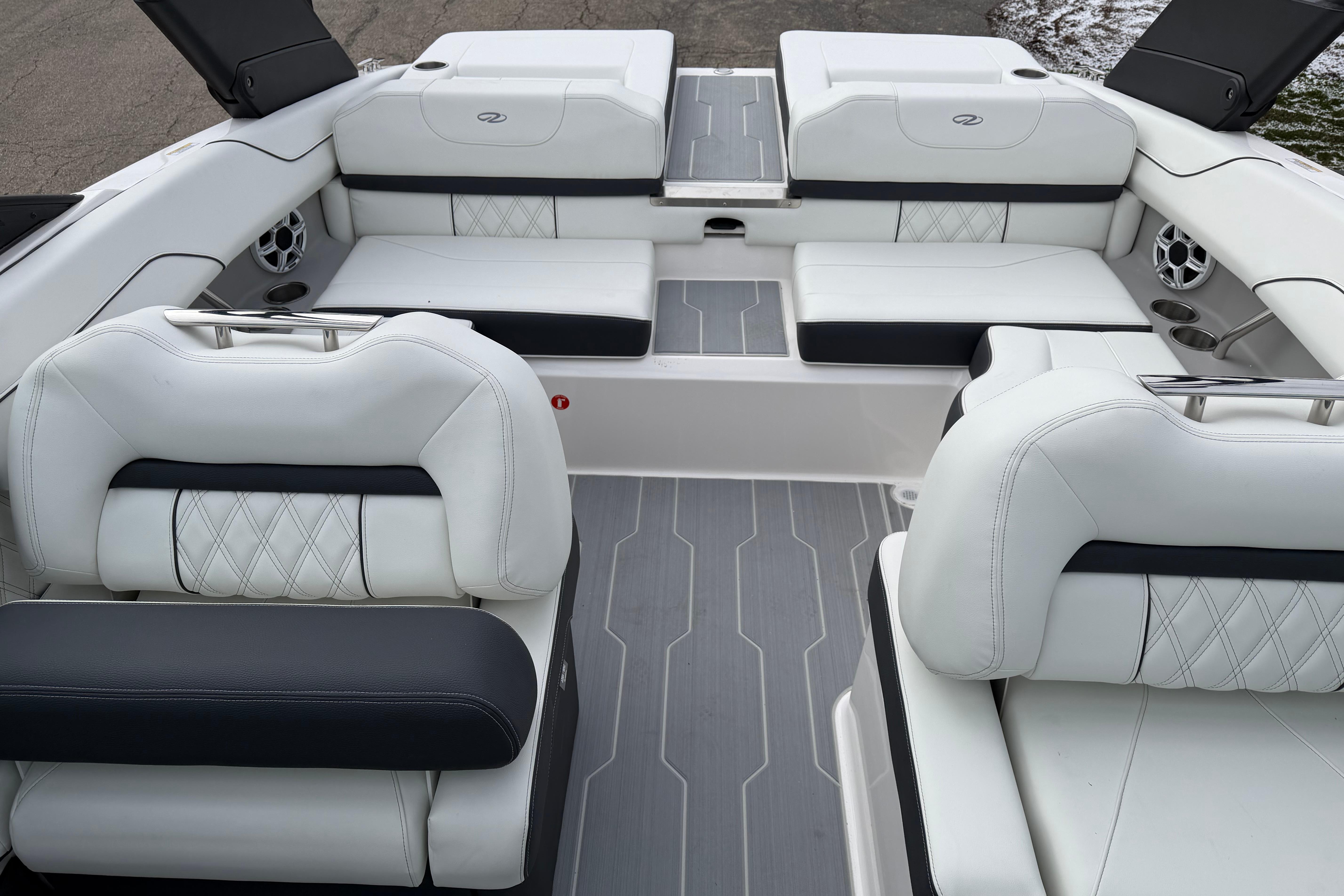 Luxurious interior of 2026 Regal LS2 Surf boat with white seating and modern design.