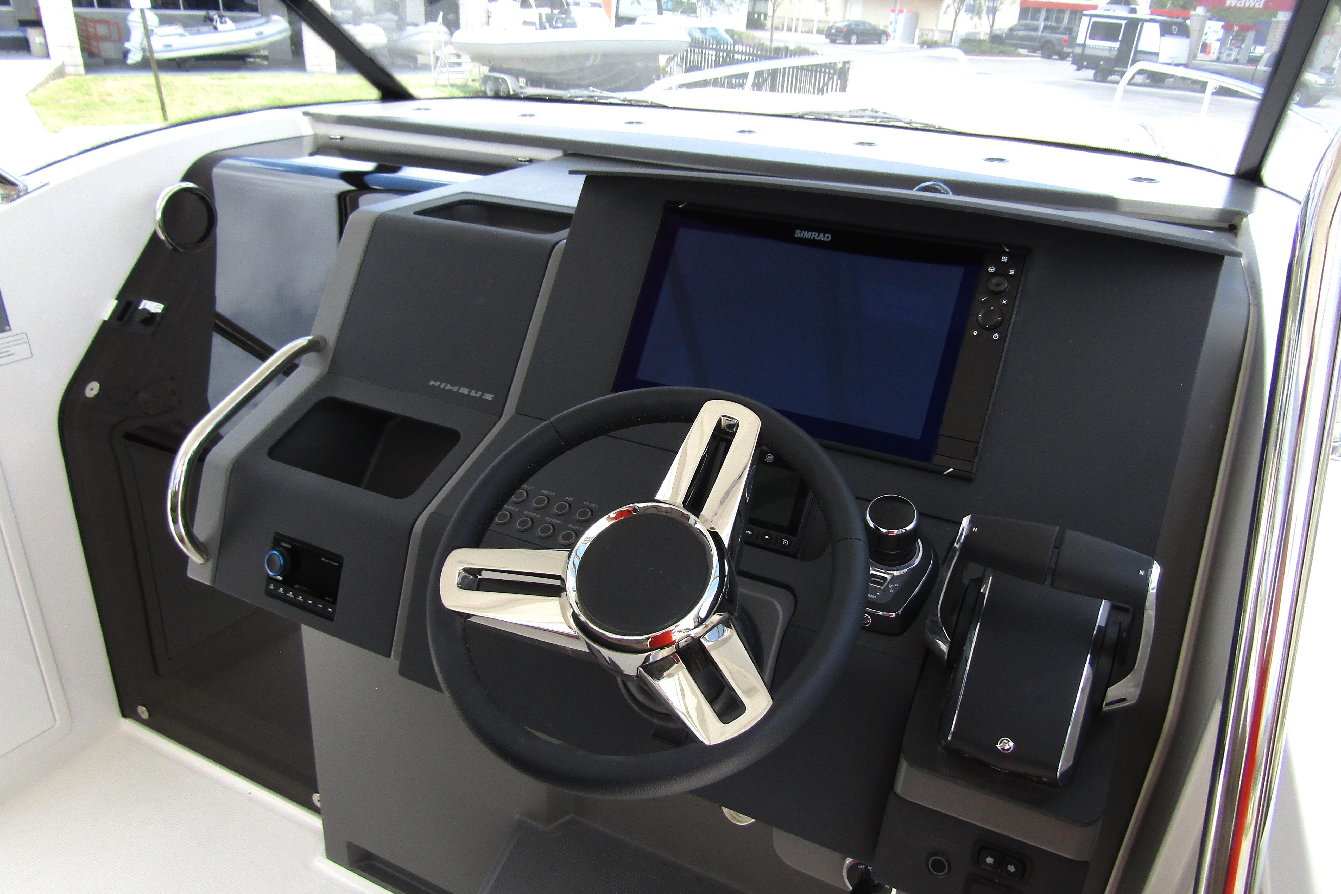 Cockpit of 2025 Nimbus Tender 11 with modern steering and navigation system.