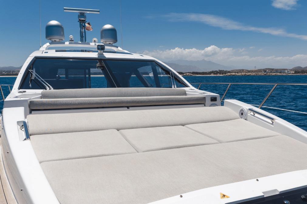 2020 Azimut 60 yacht with spacious sun deck, cruising on clear blue waters.
