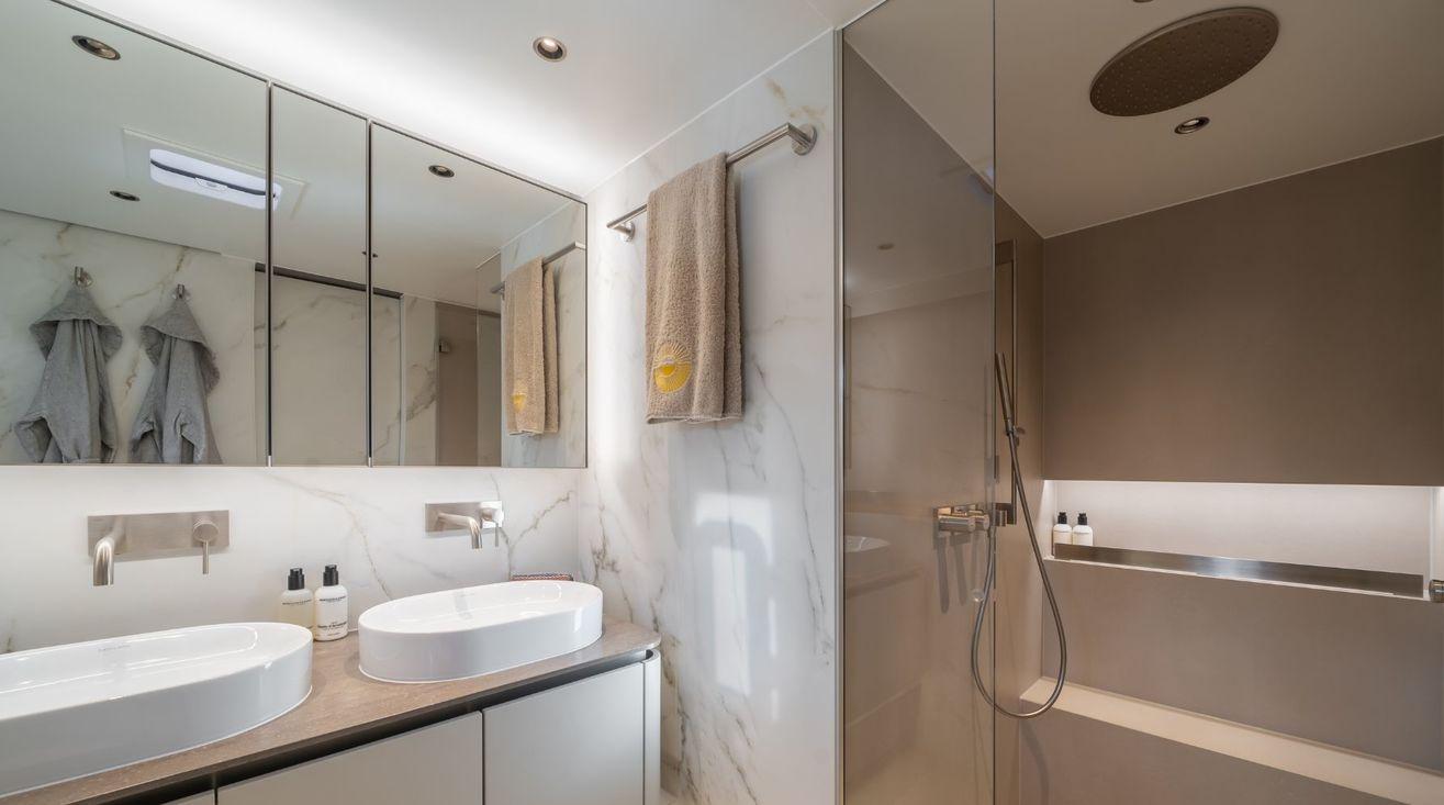 Luxurious bathroom in 2023 Sunreef 80 Eco yacht with dual sinks and modern shower.