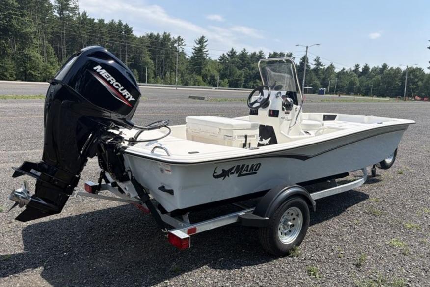 2026 Mako Pro Skiff 15 CC boat on trailer, featuring Mercury outboard motor.