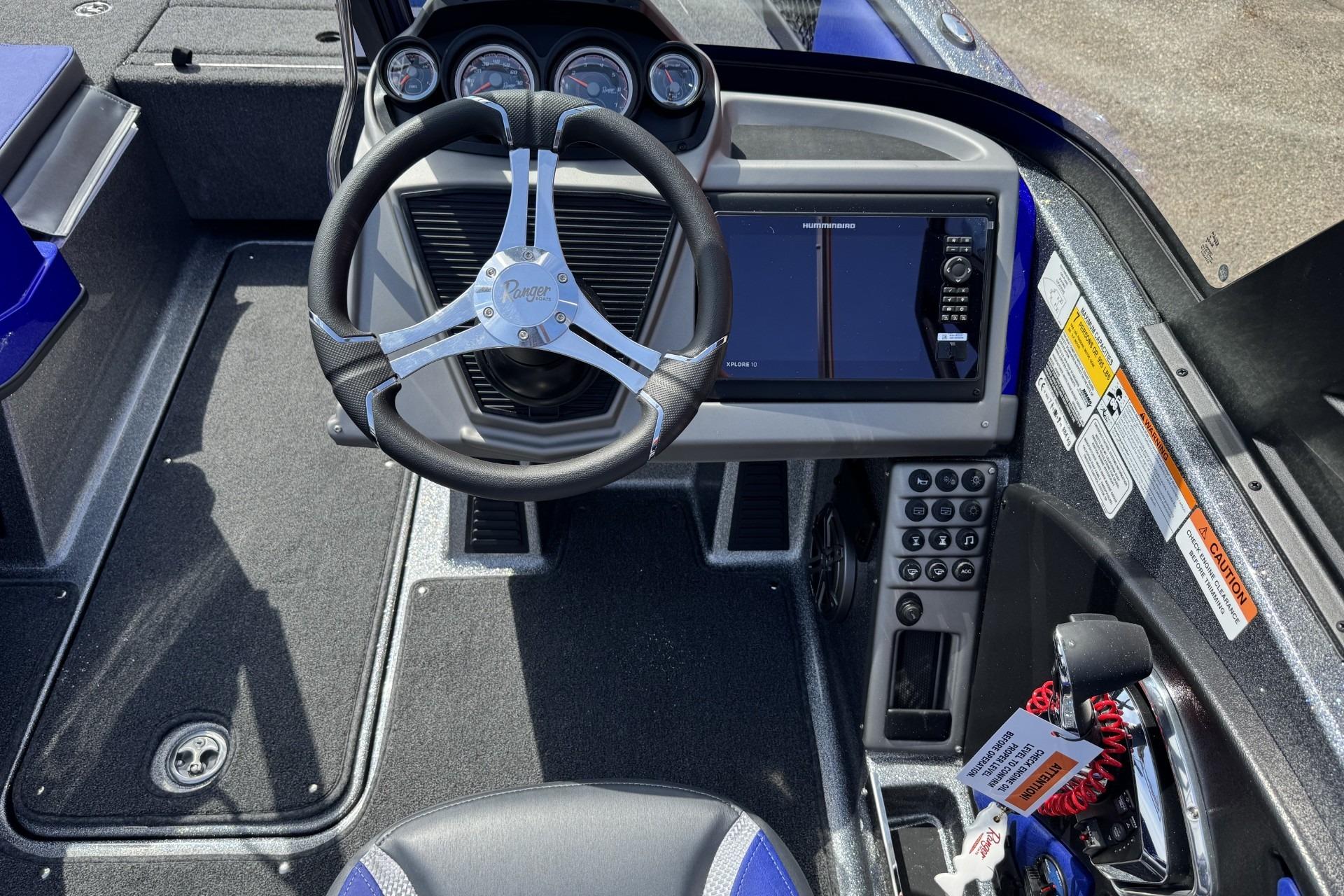 2026 Ranger 2050MS boat cockpit with steering wheel and control panel.
