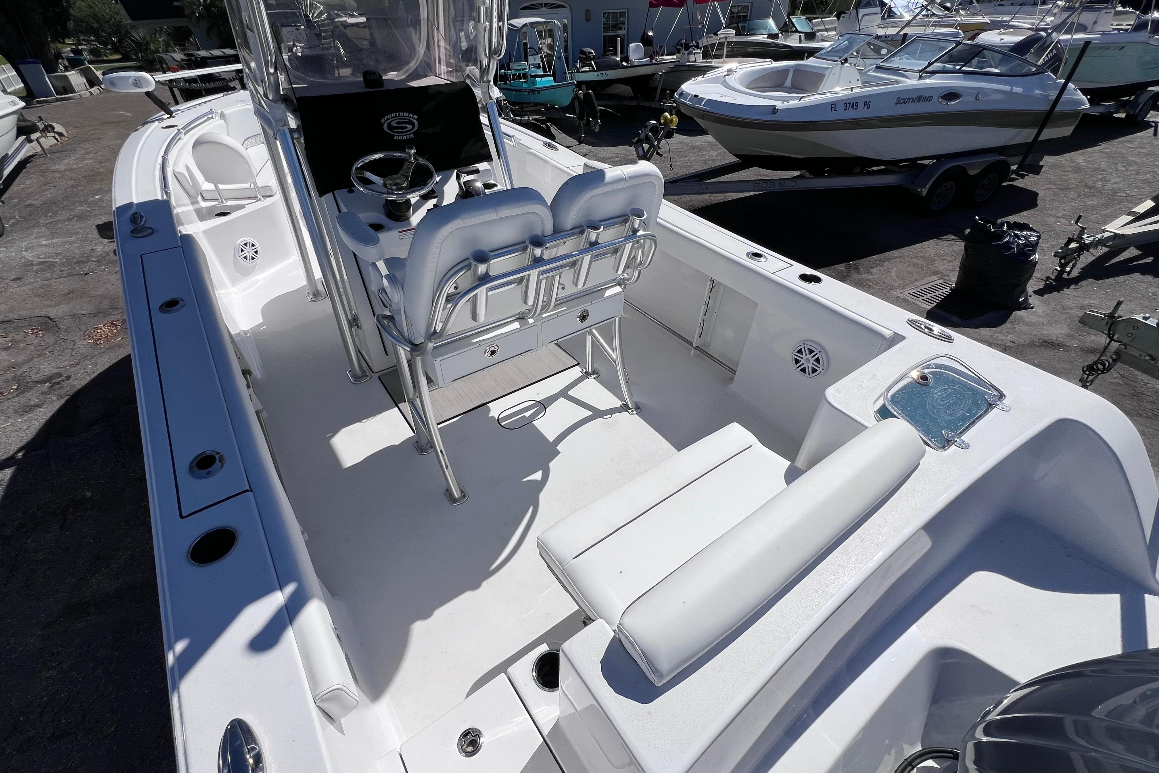 2023 Sportsman Open 242 Center Console boat interior with seating and steering console.
