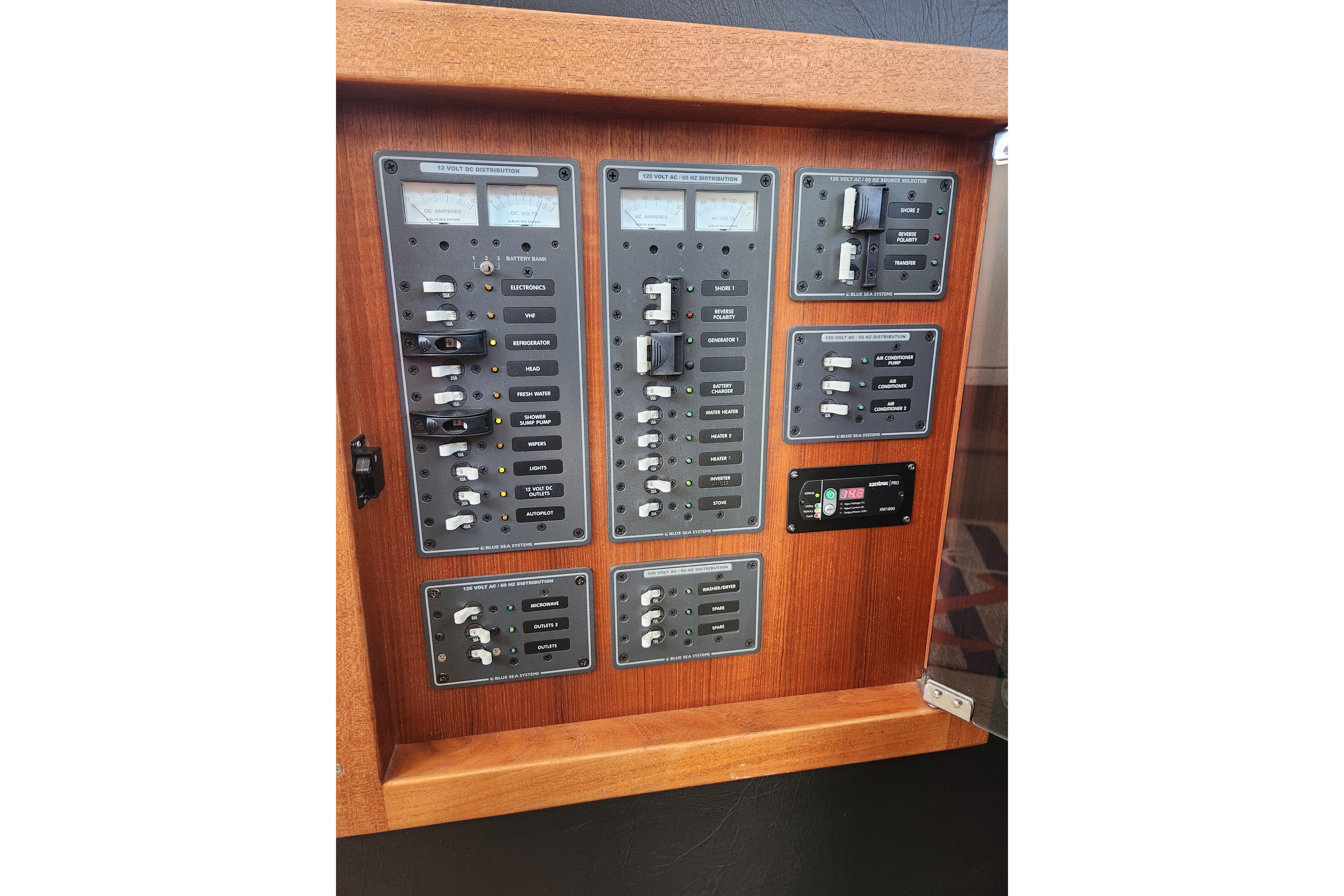 Electrical control panel on a 2006 American Tug AT boat, featuring switches and gauges.