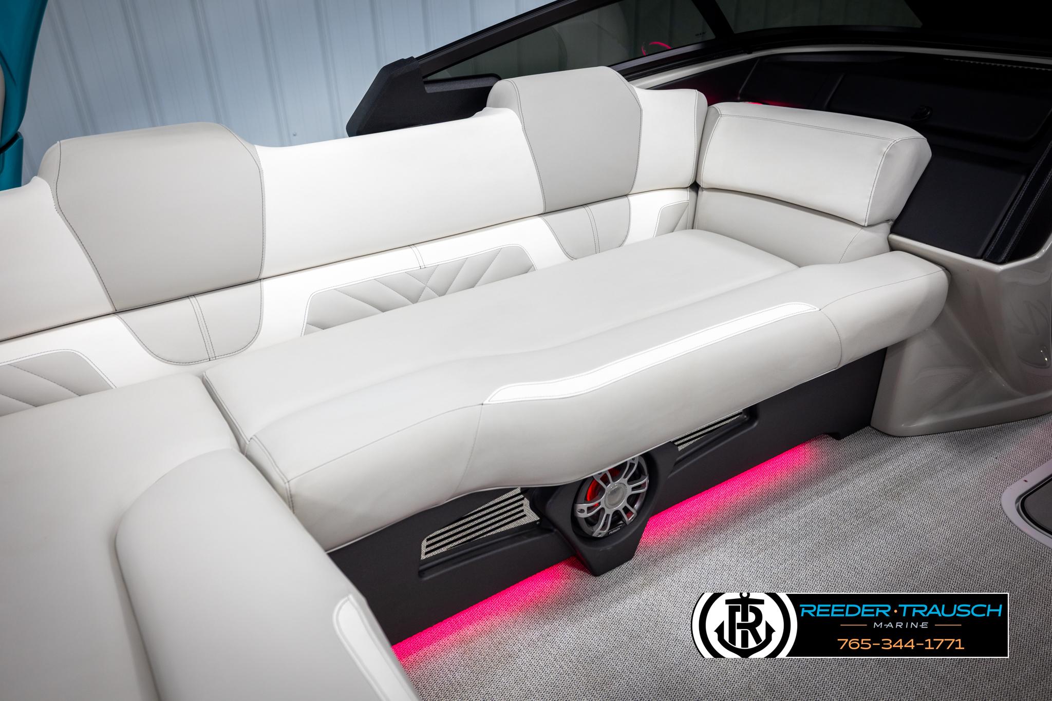 Luxurious seating in the 2025 Avalon 2585 Excal VRBW boat with ambient lighting.