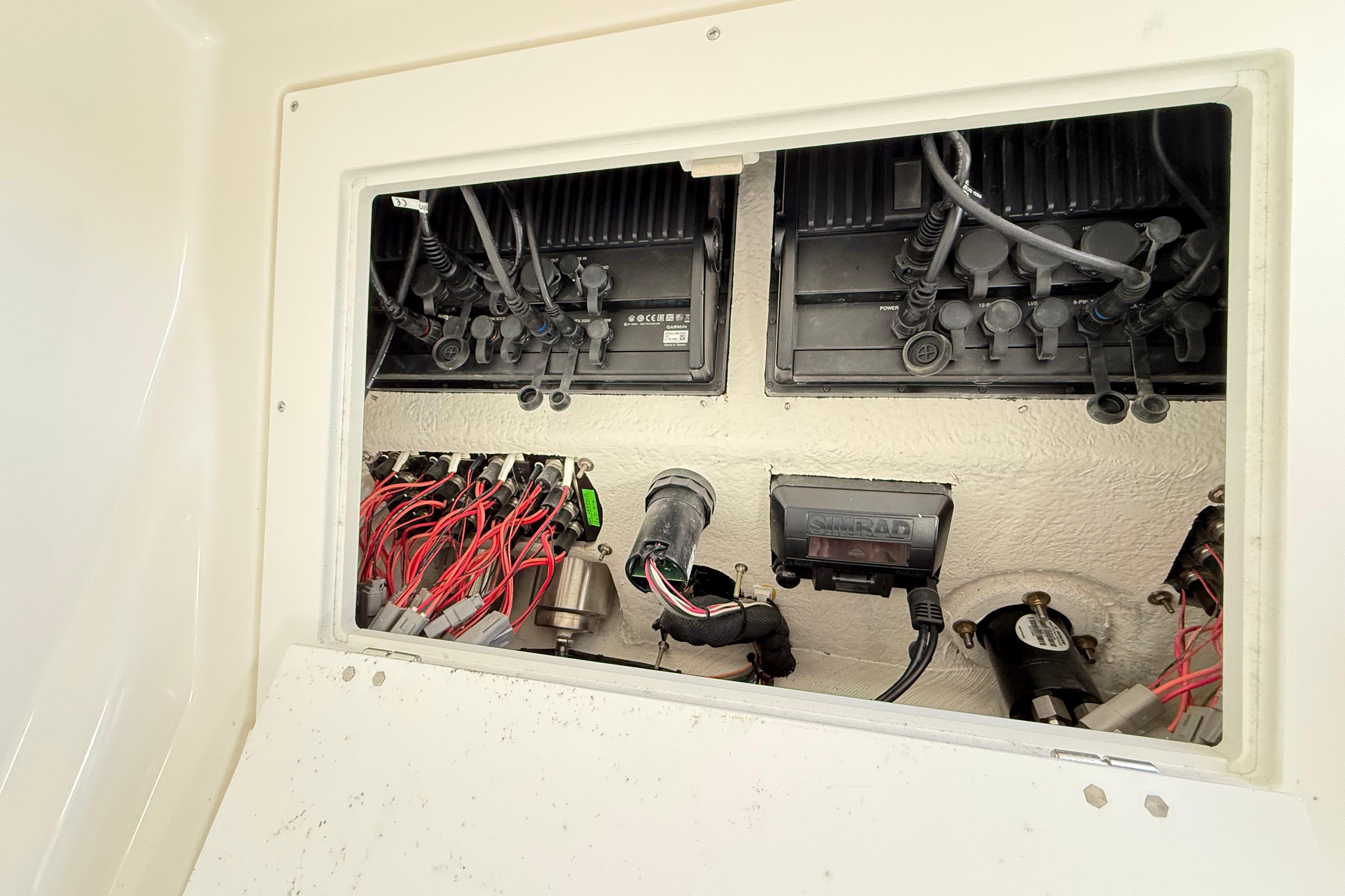 Electrical wiring and components inside a 2023 Caymas 281 HB boat.
