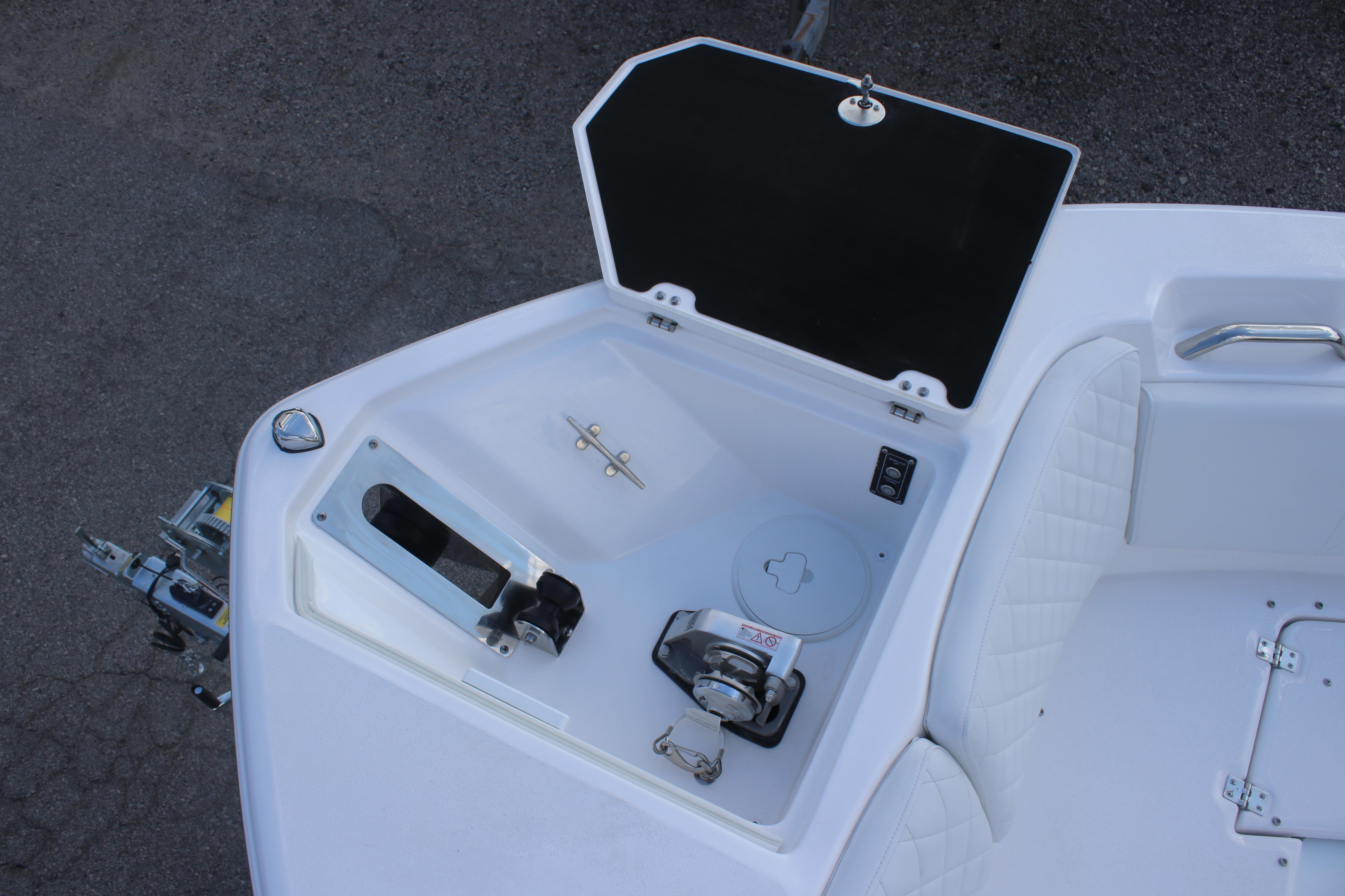 2026 Sea Fox 268 Commander boat anchor compartment with open hatch and seating area.