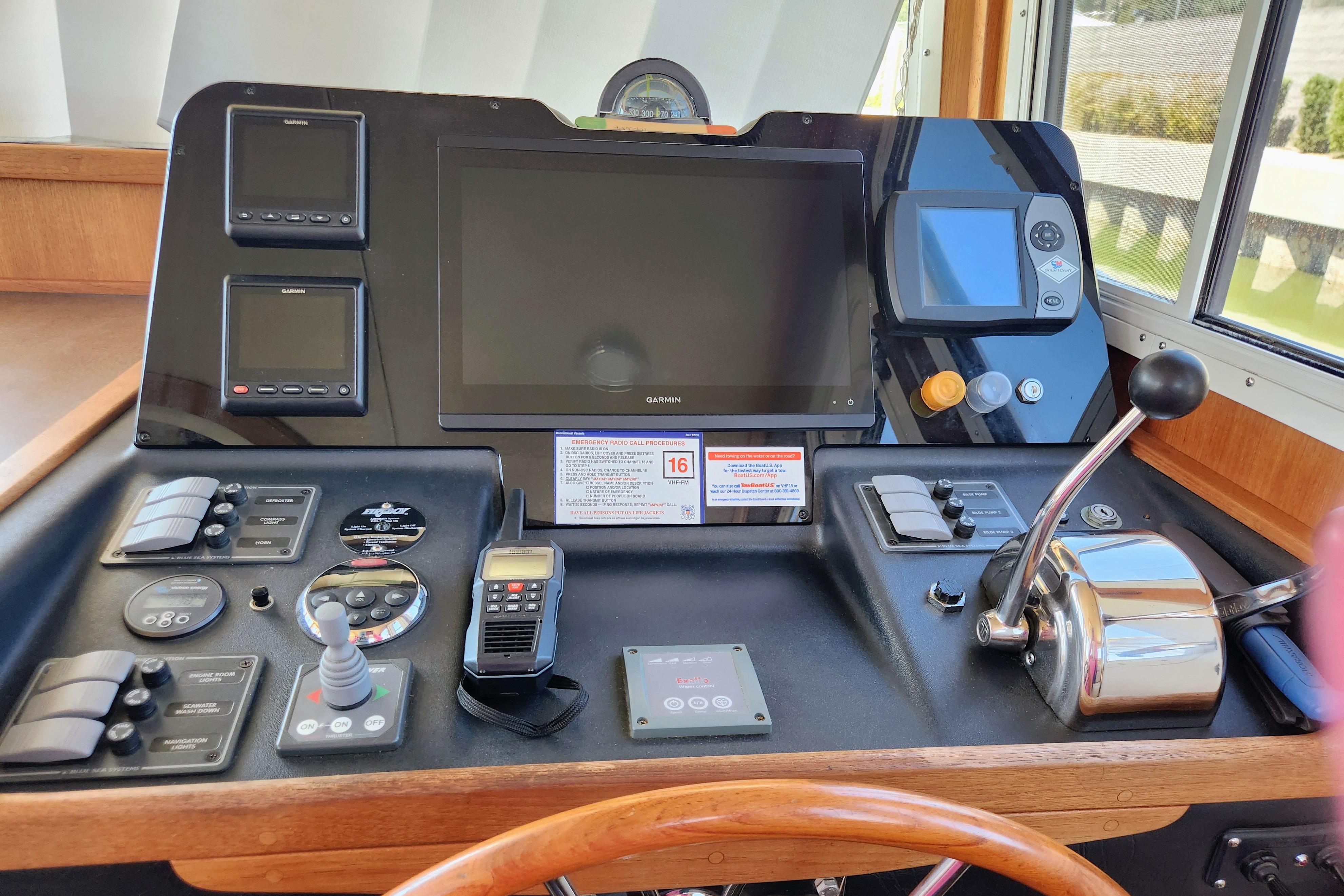 Control panel of a 2006 American Tug AT boat with navigation and communication equipment.