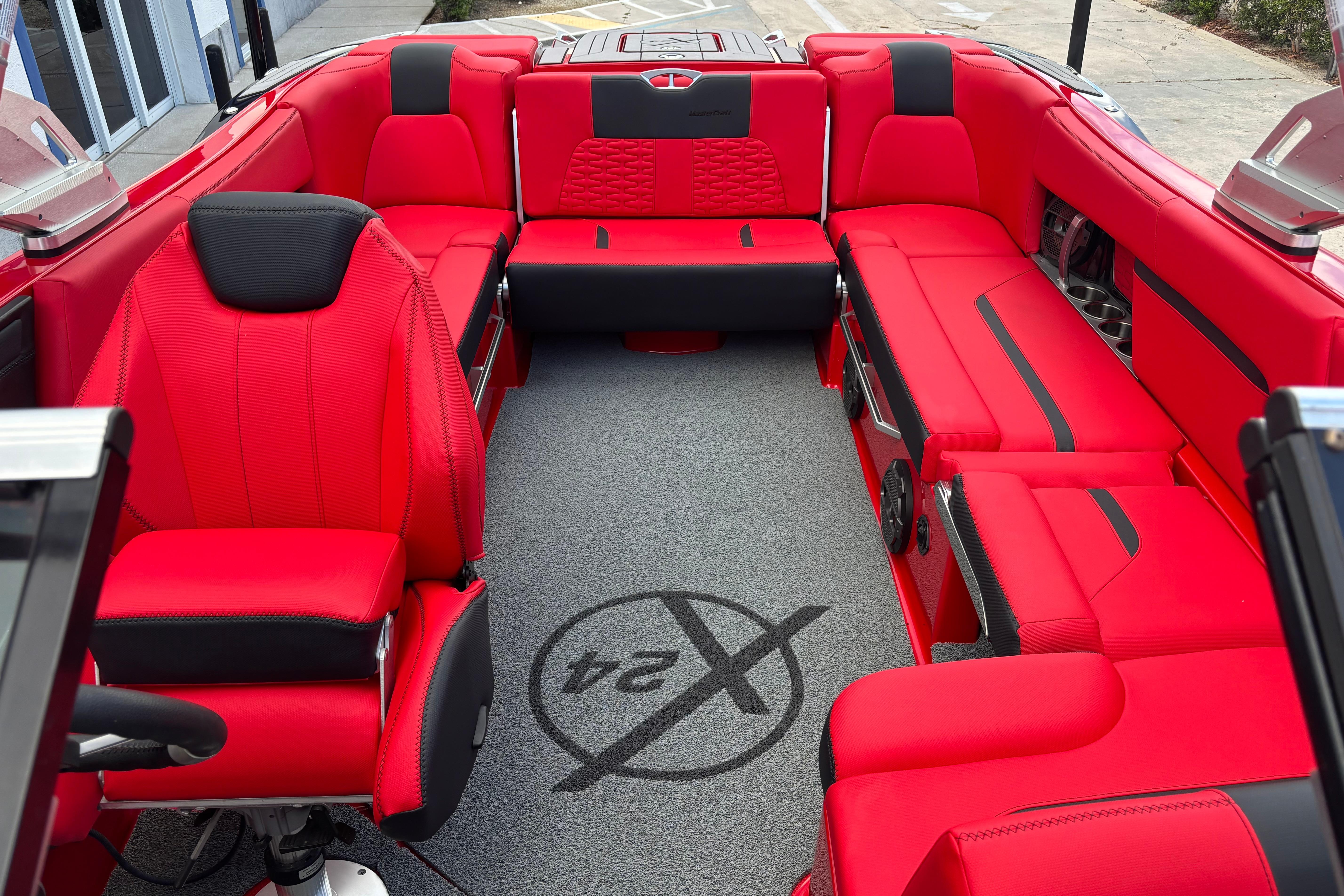 2020 MasterCraft X24 boat interior with vibrant red seating and modern design.