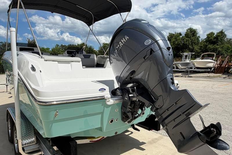 2026 Hurricane SunDeck Sport 2050 OB boat with Yamaha outboard motor on trailer.