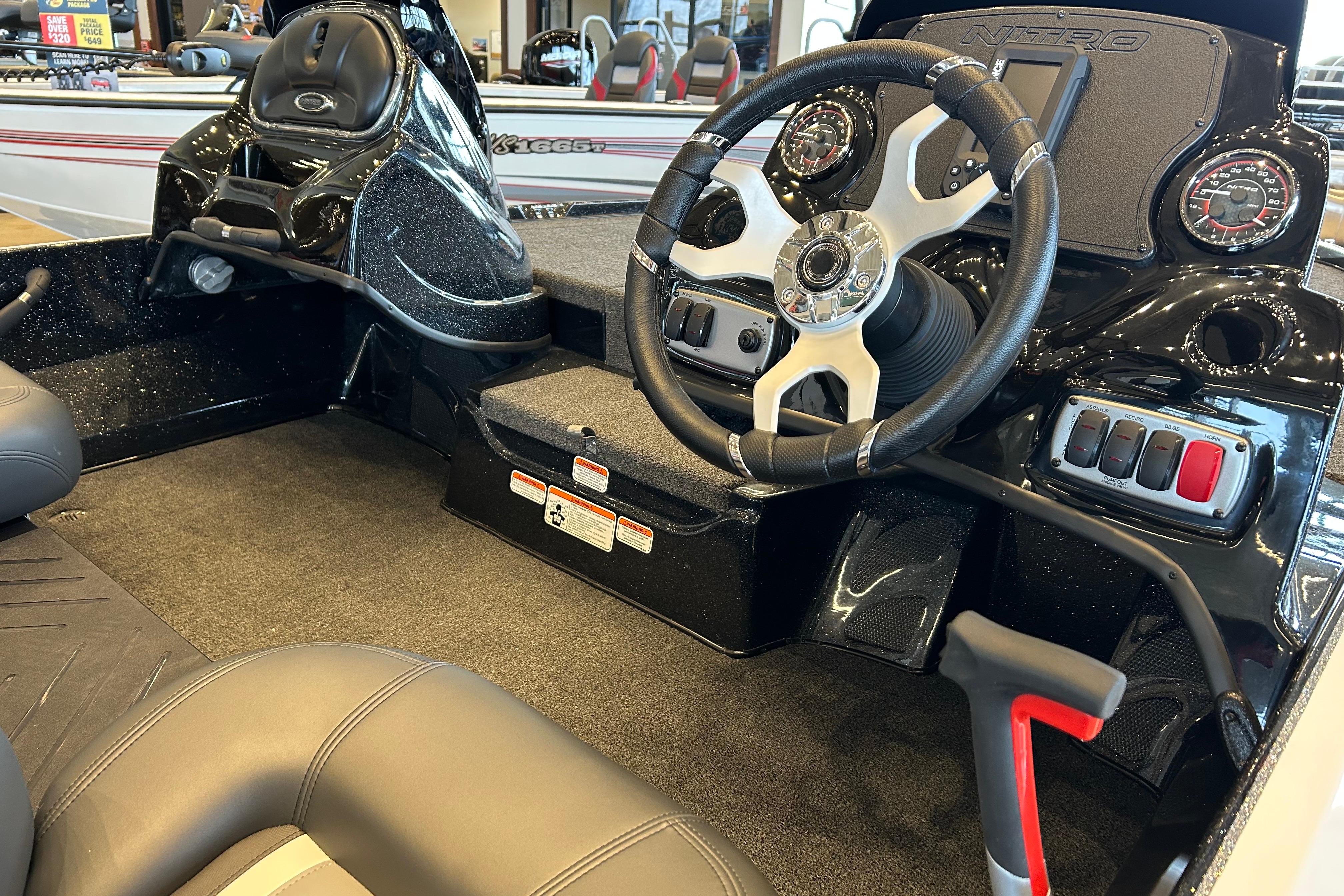 2026 Nitro Z17 boat cockpit with steering wheel, gauges, and control panel.