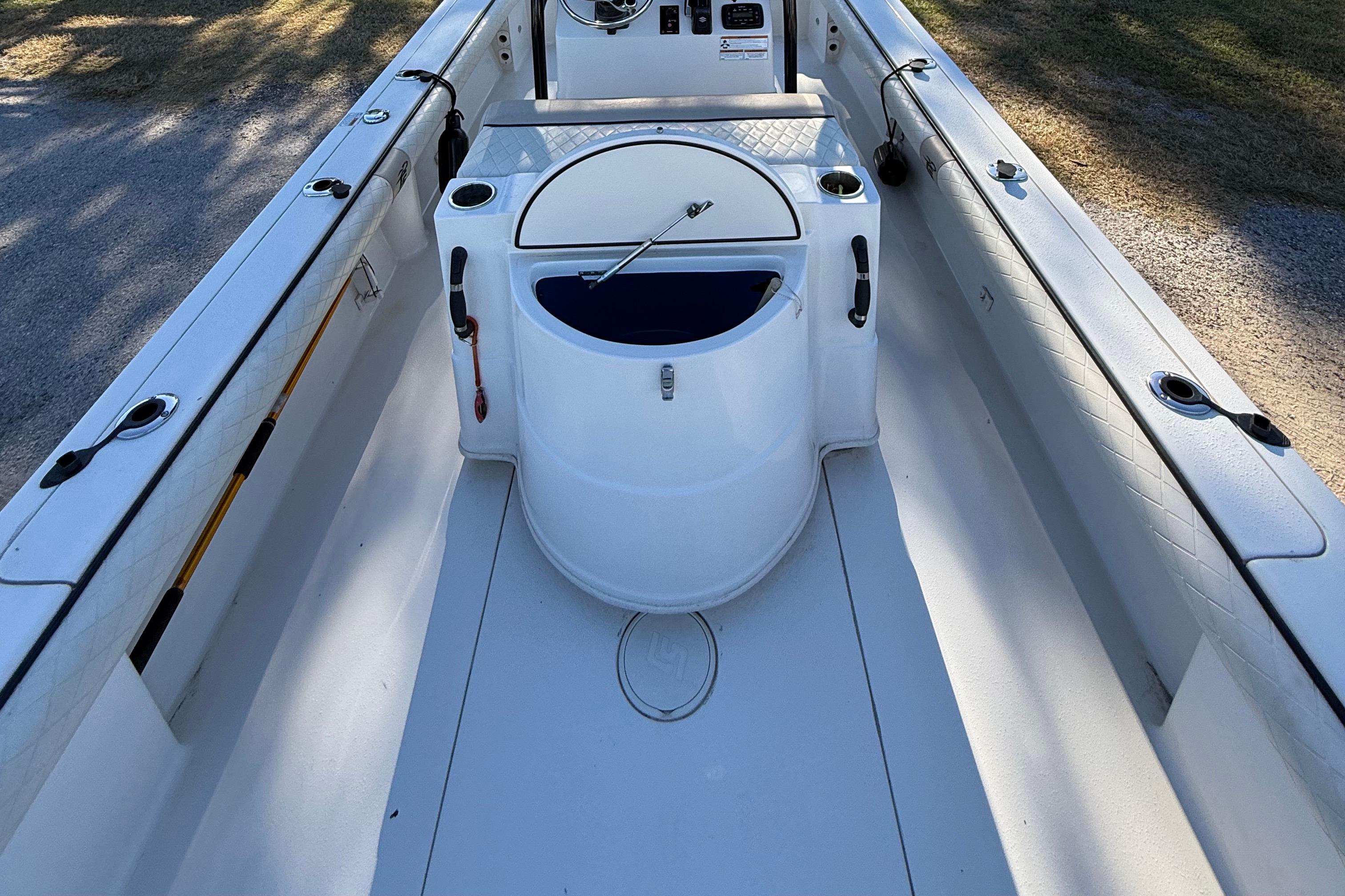 2021 Carolina Skiff 26 Ultra Elite boat interior with center console and rod holders.