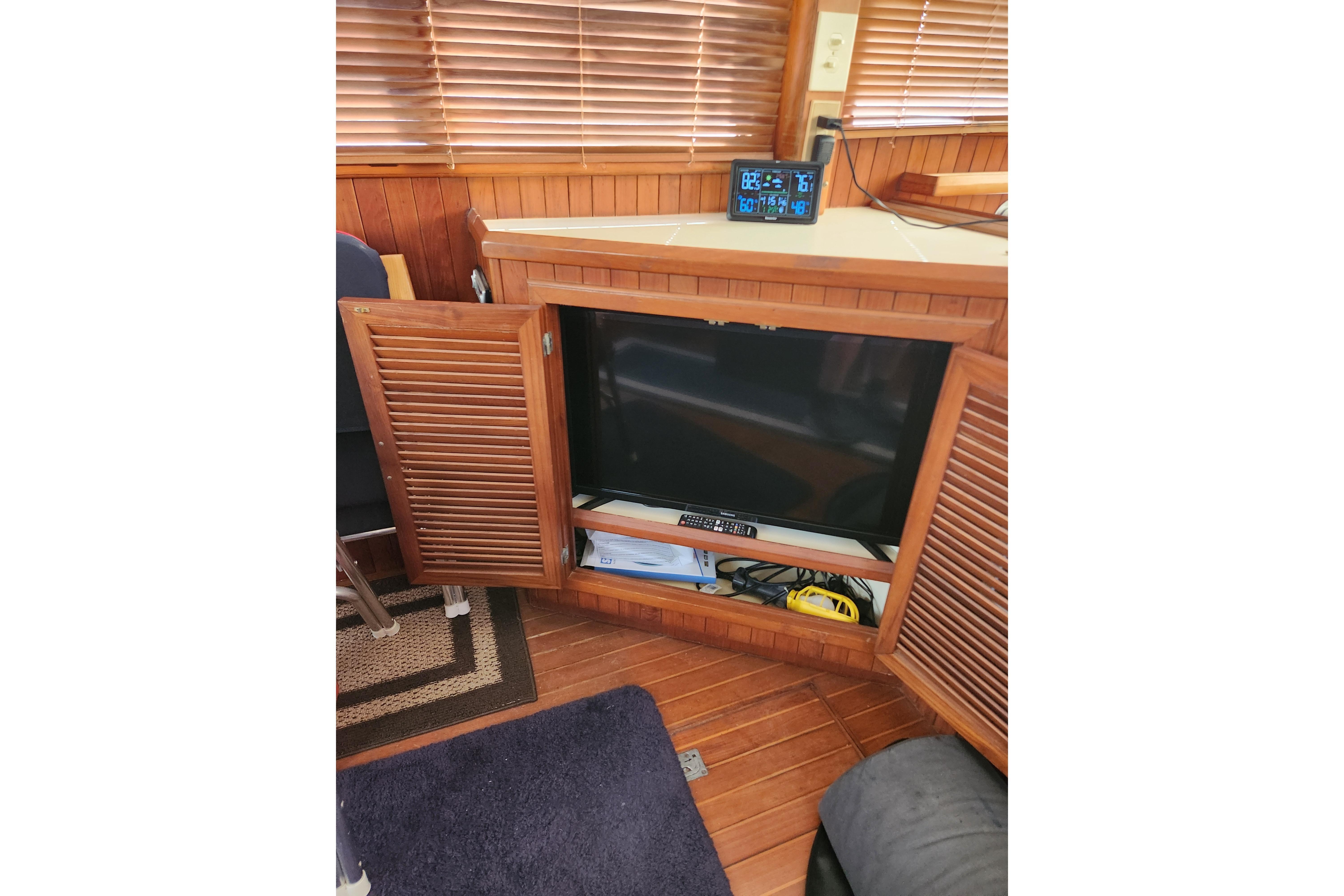 Interior of a 1988 Overseas Monk 42 yacht with wooden cabinetry.