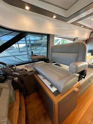 2019 Tiara Yachts C53 helm station with luxurious leather seating and modern controls.