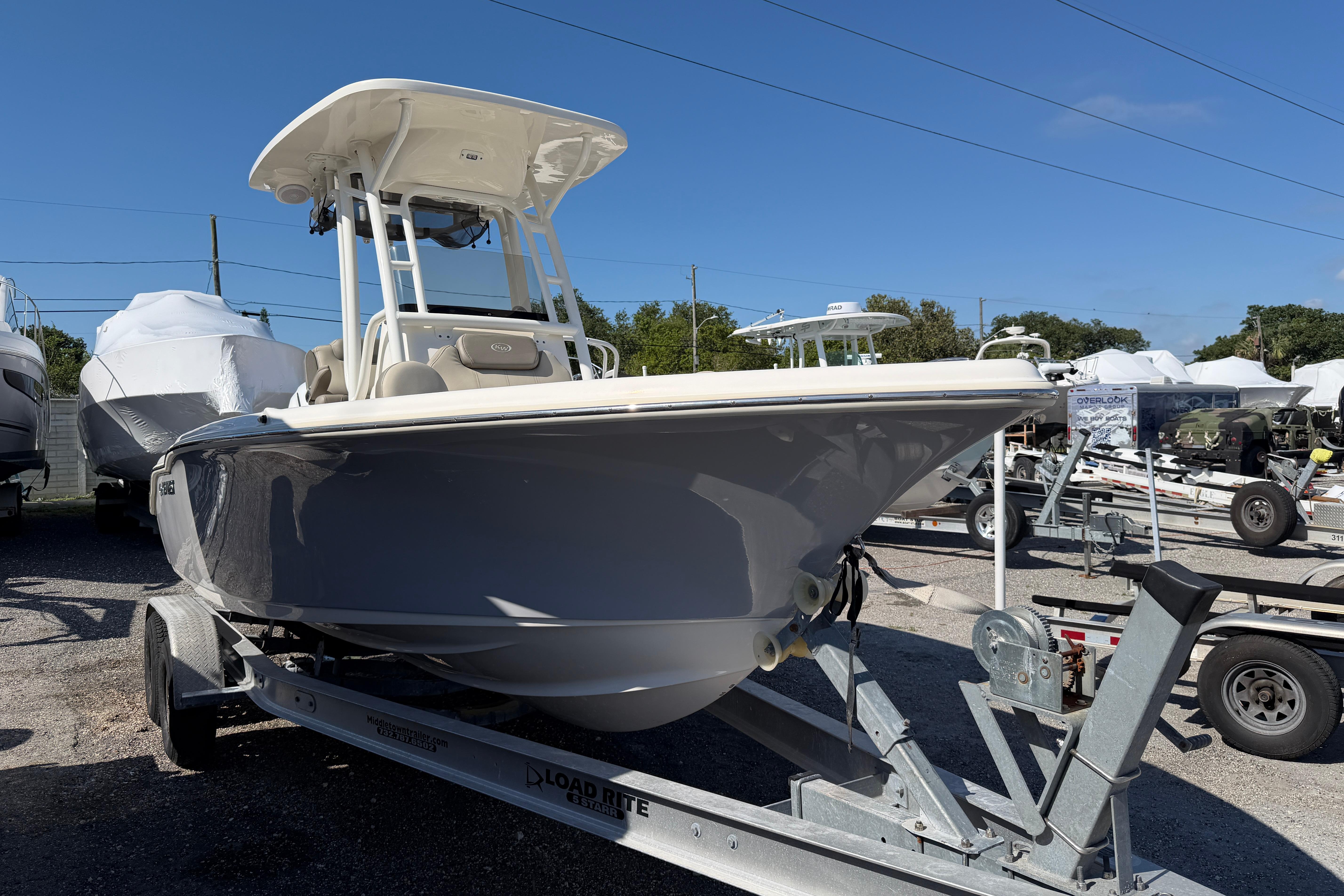 2022 Key West 219 FS boat on trailer in outdoor lot.