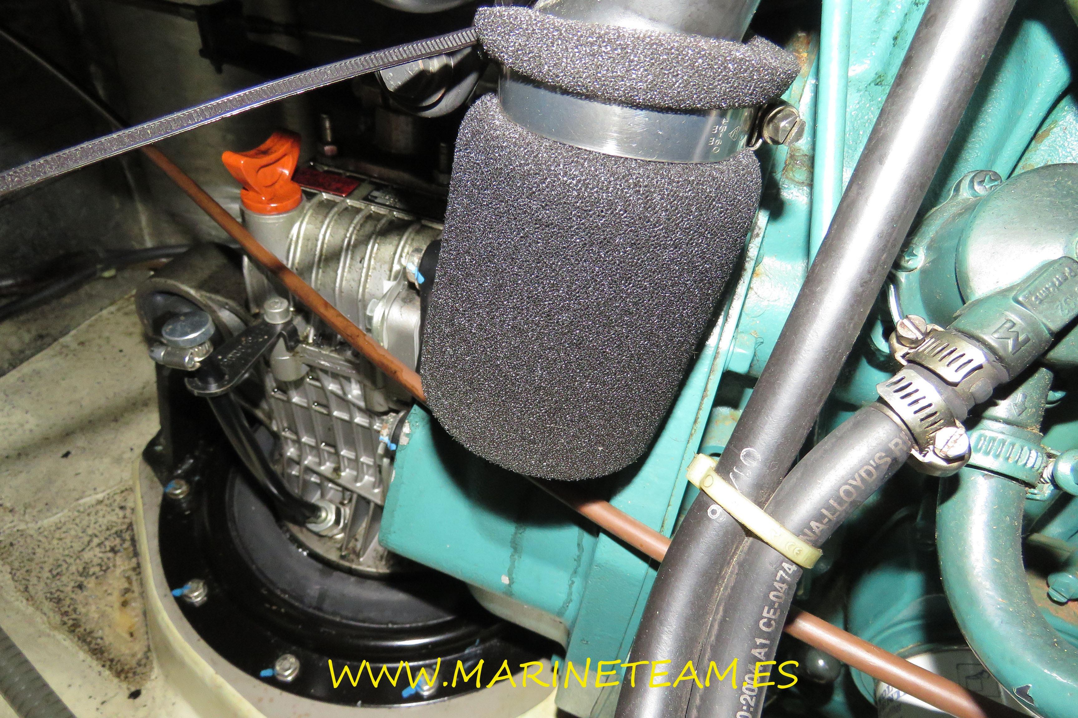 Engine compartment of a 2005 Shipman 50 yacht, featuring hoses and components.