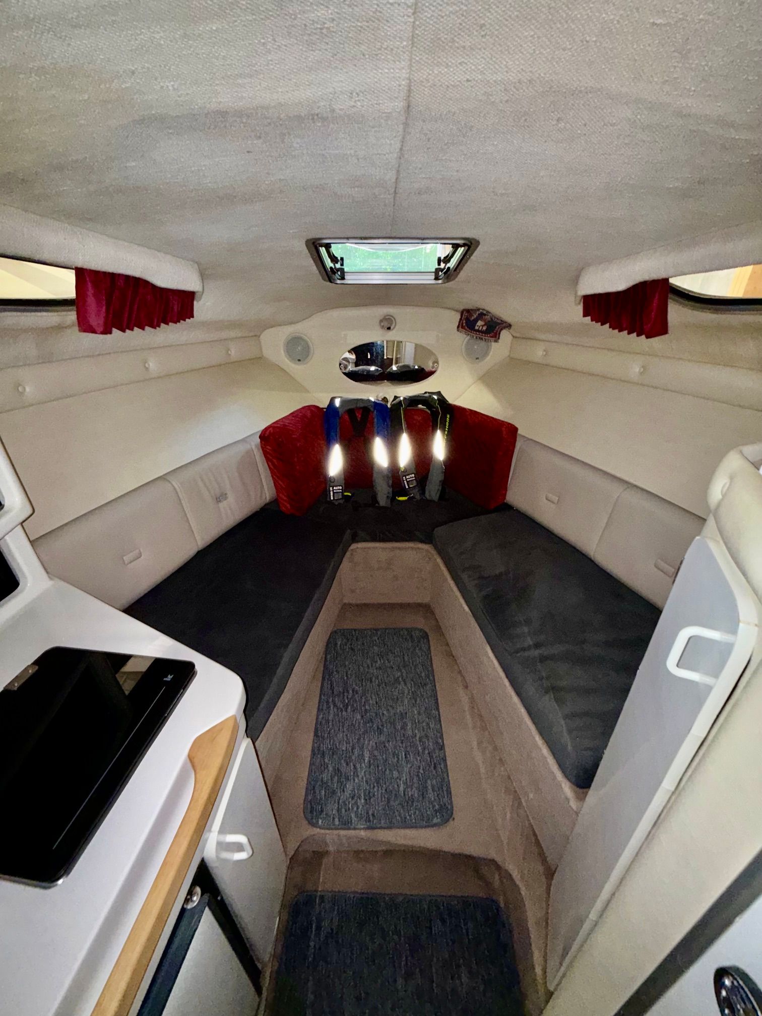 Interior of the 1997 Chaparral Signature 260 with cozy seating and skylights.
