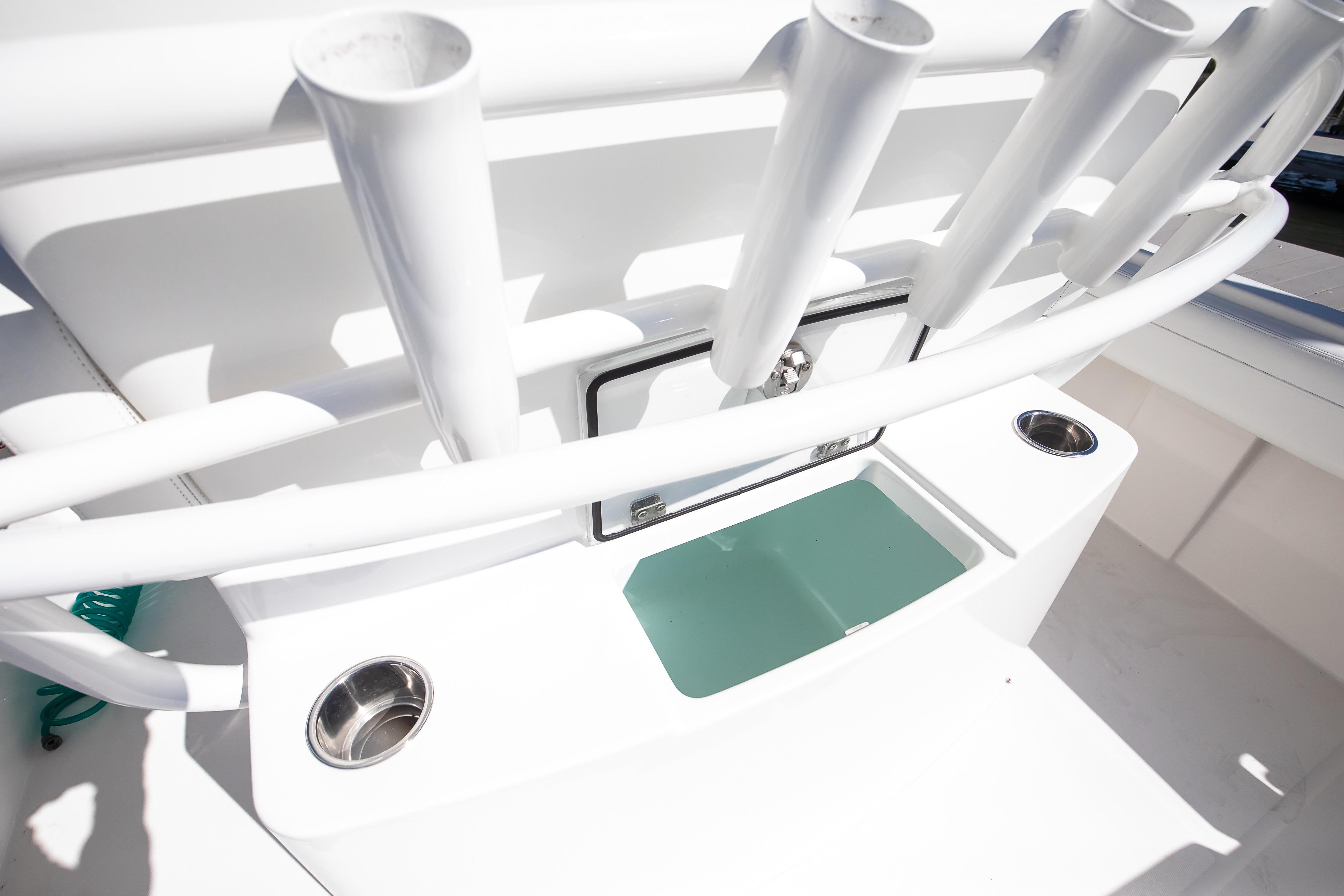 2022 Regulator 28 Forward Seating boat with rod holders and storage compartment.