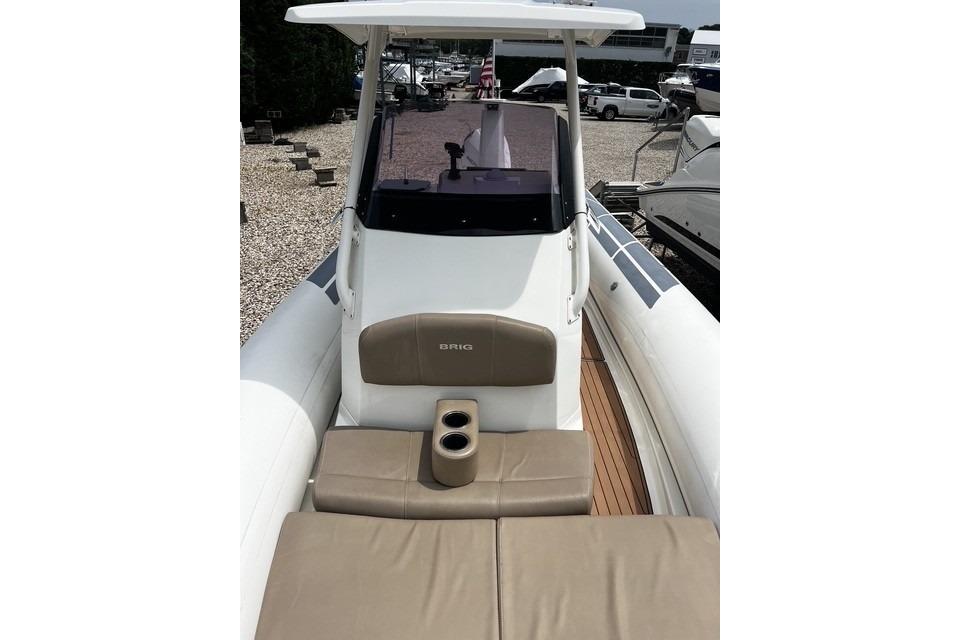 2022 Brig Eagle 8 boat interior with cushioned seating and cup holders.