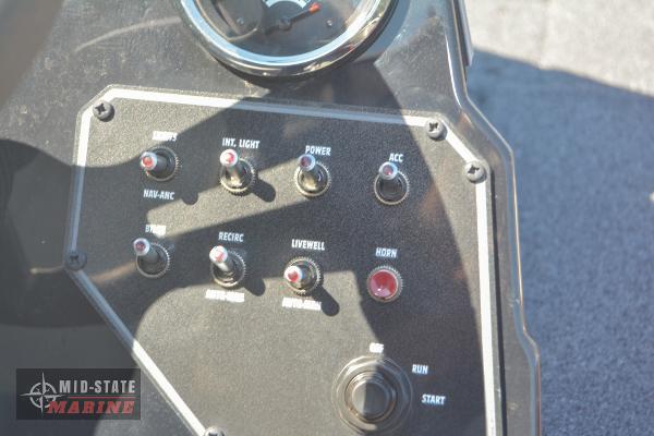 Control panel of 2024 Lowe Stinger 195 Bass boat with various switches and gauges.