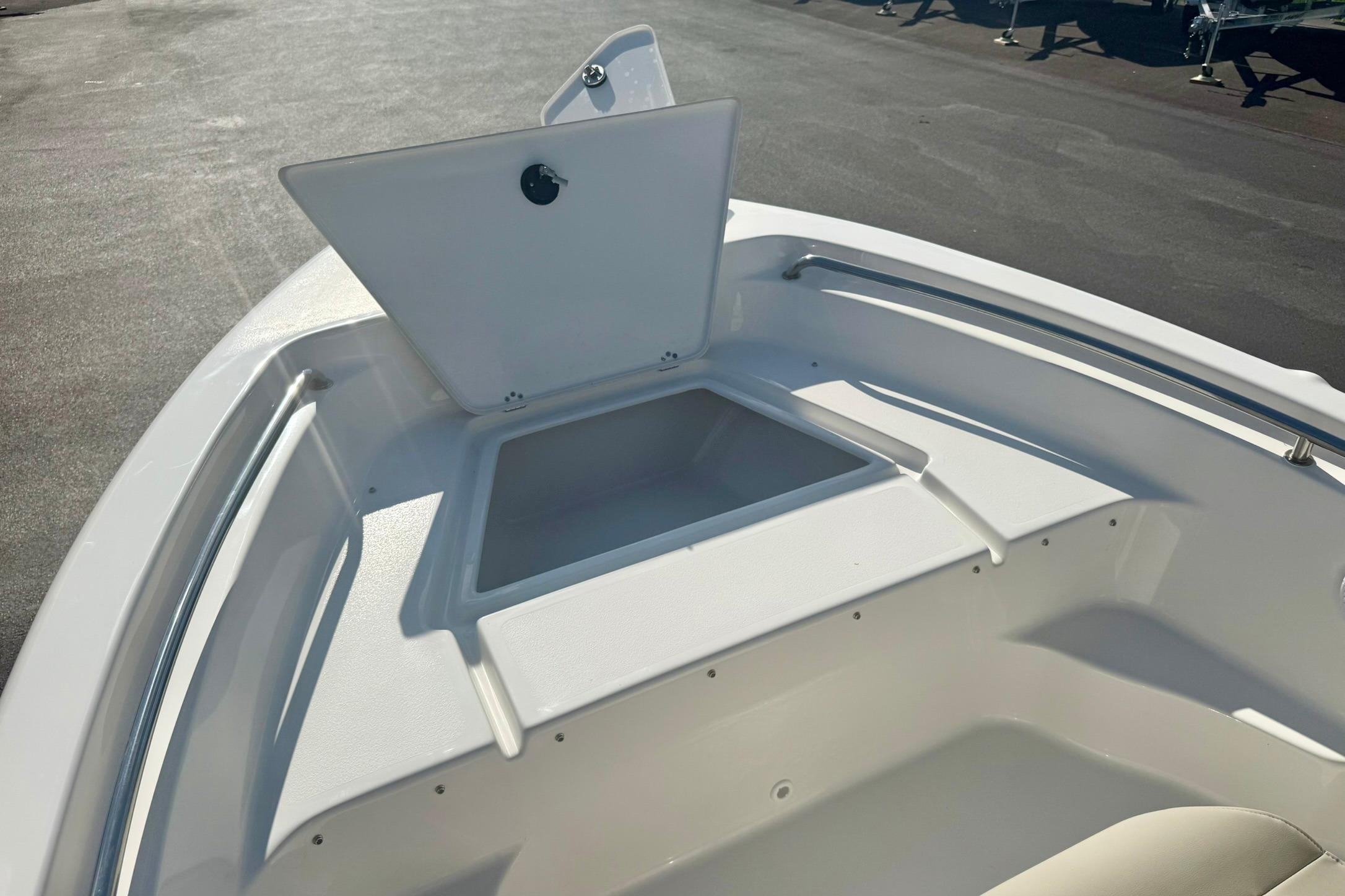 2026 Key West 189 FS boat with open storage compartment on deck.