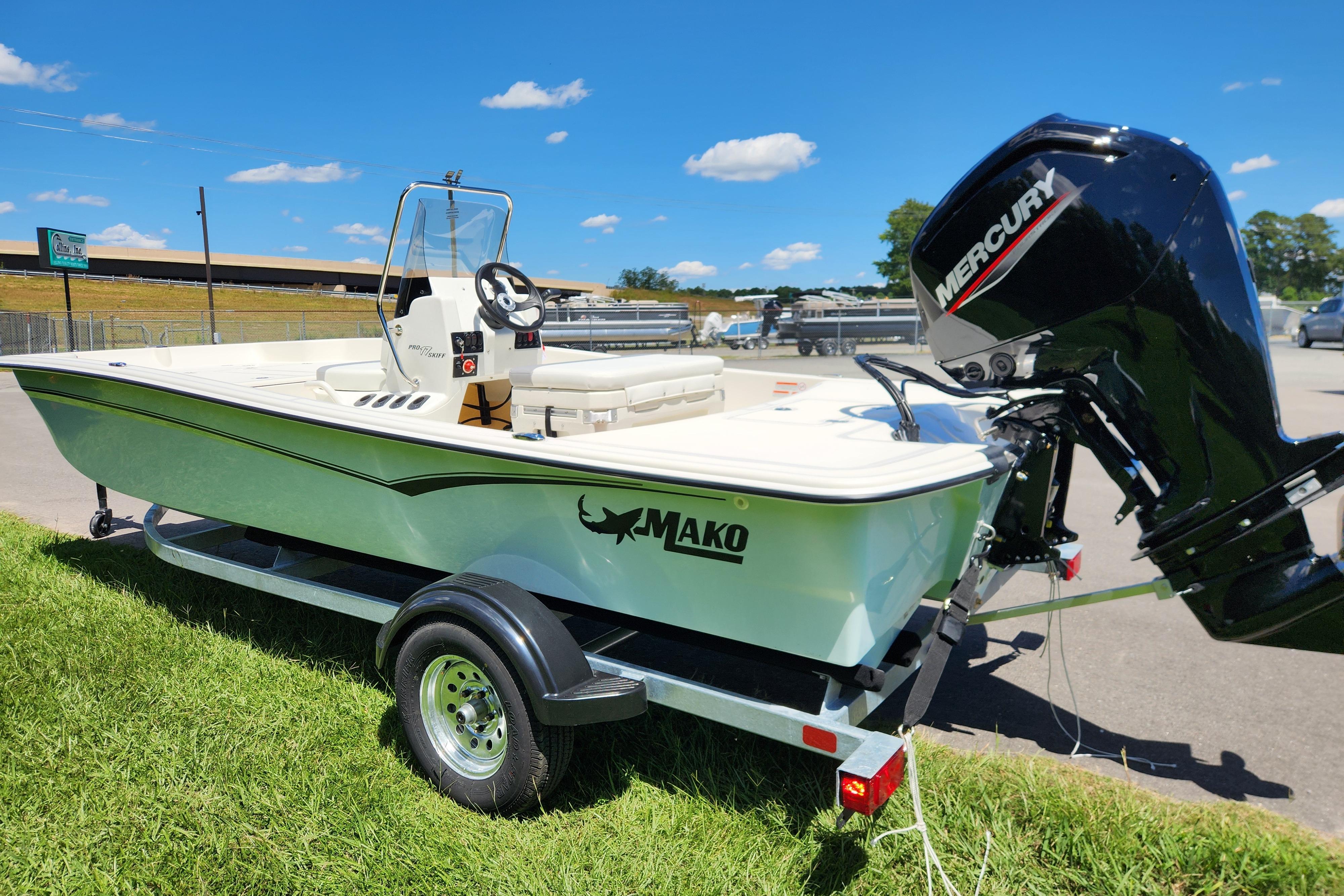 2026 Mako Pro Skiff 17 CC boat on trailer with Mercury outboard motor.
