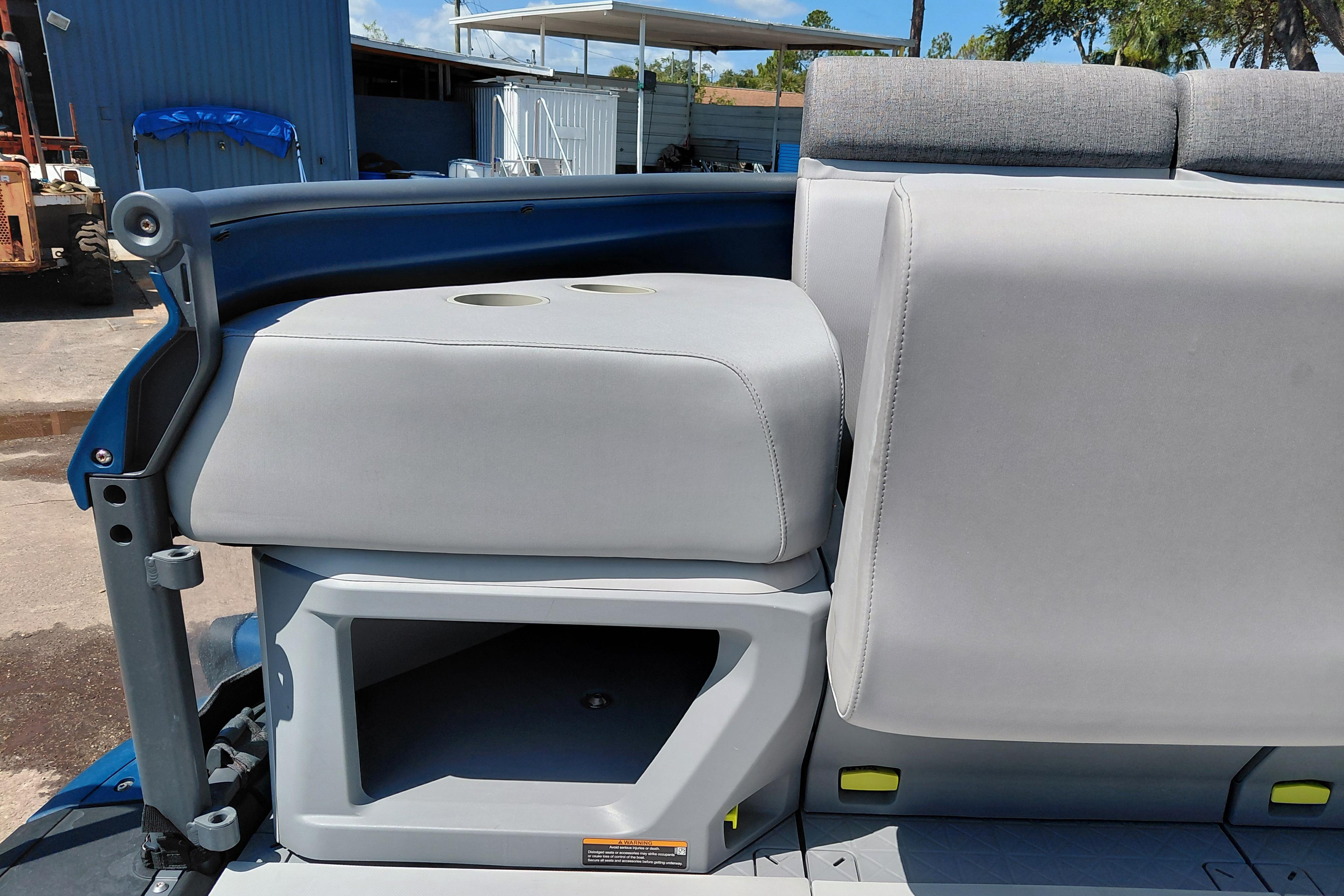 2024 Sea-Doo Switch Cruise 18 interior seating with storage compartment and cup holders.