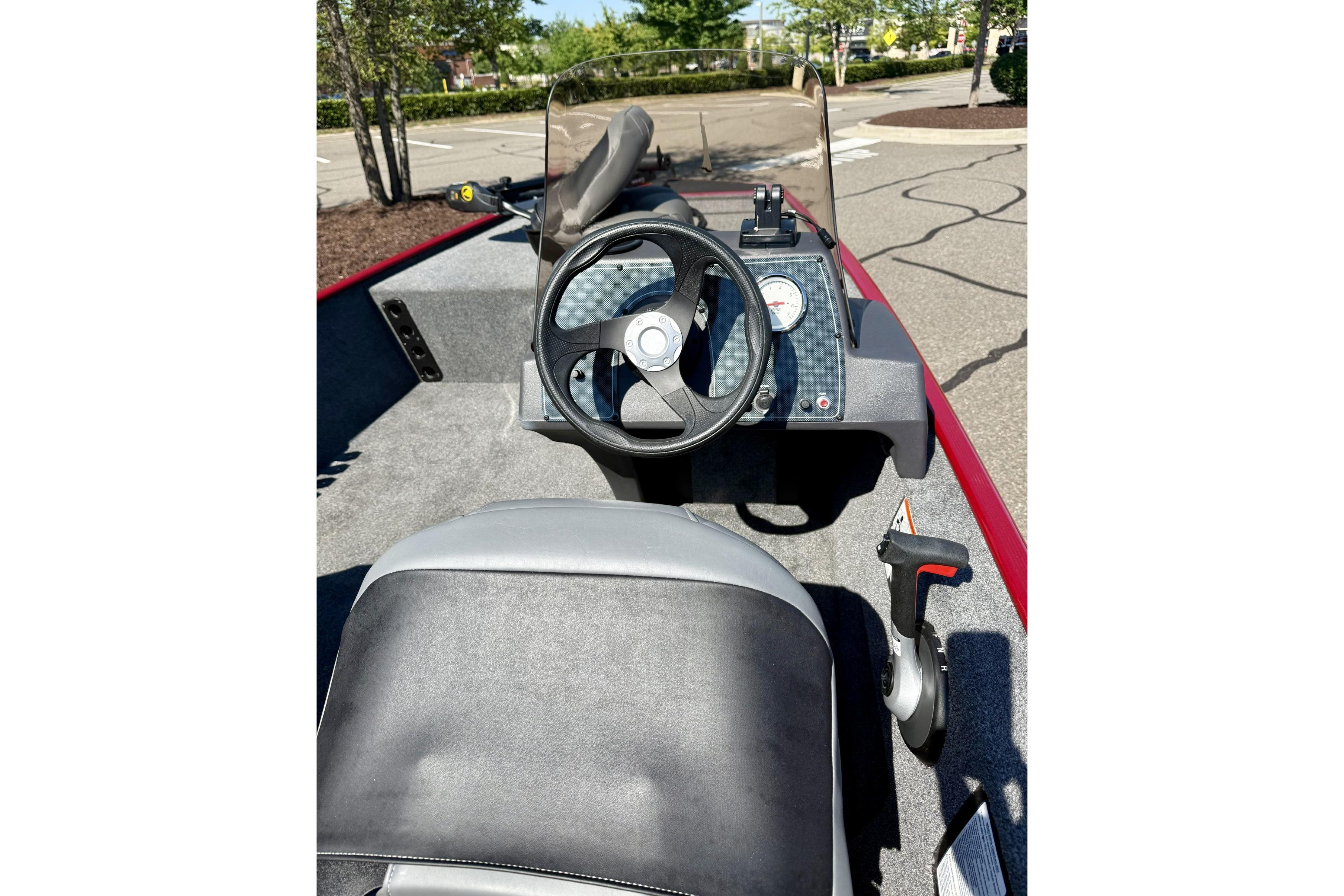 2023 Tracker Bass Tracker Classic XL boat interior with steering wheel and dashboard controls.