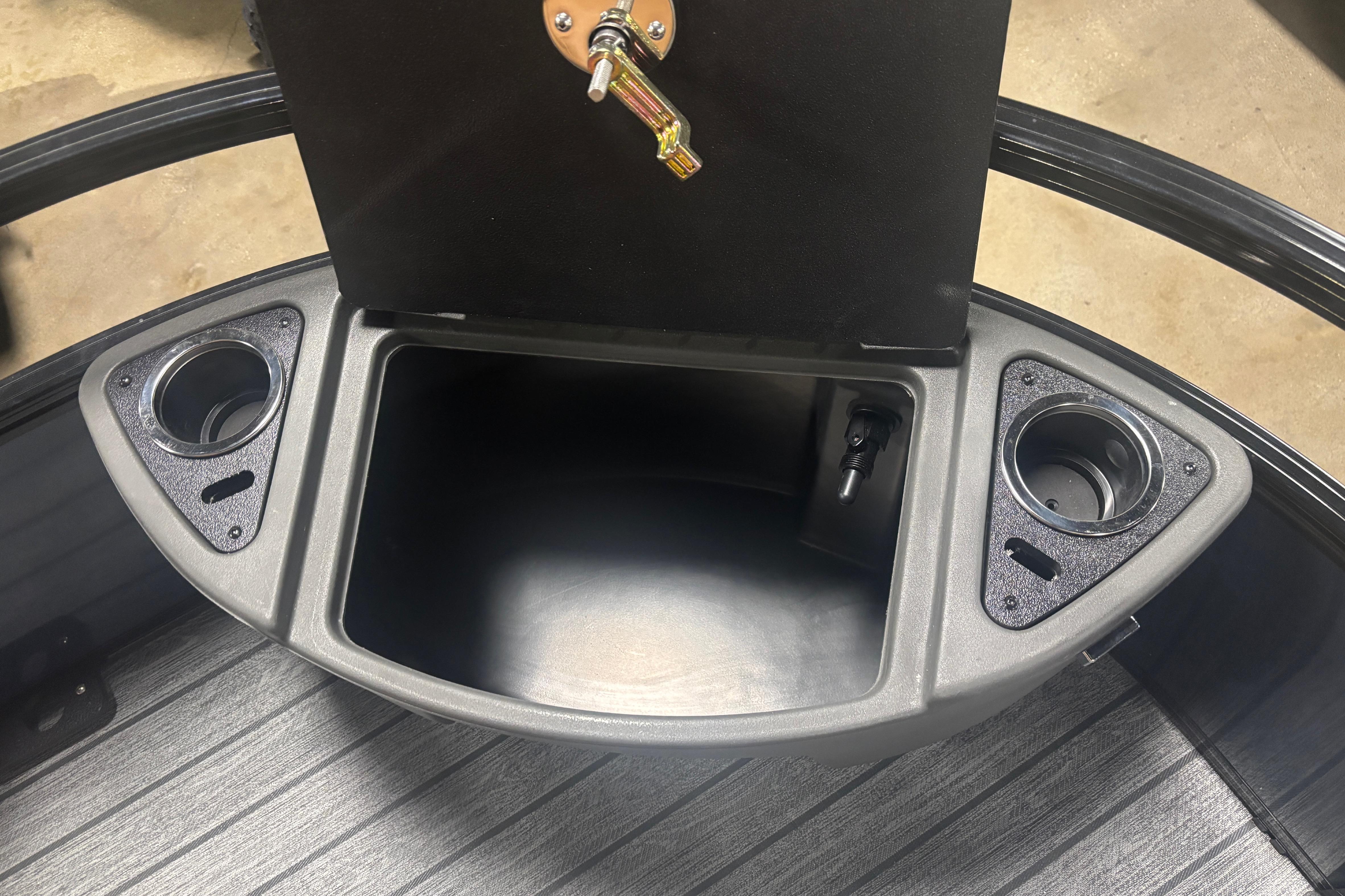 2026 Ranger 223F boat console with storage compartment and cup holders.