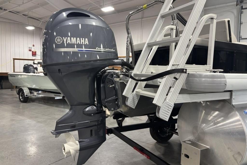 2026 Godfrey Xperience 2086 SFLX with Yamaha outboard motor in showroom.