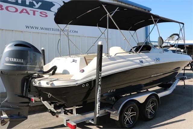 A 2022 Stingray 212 SC boat on a trailer, featuring a Yamaha outboard motor.