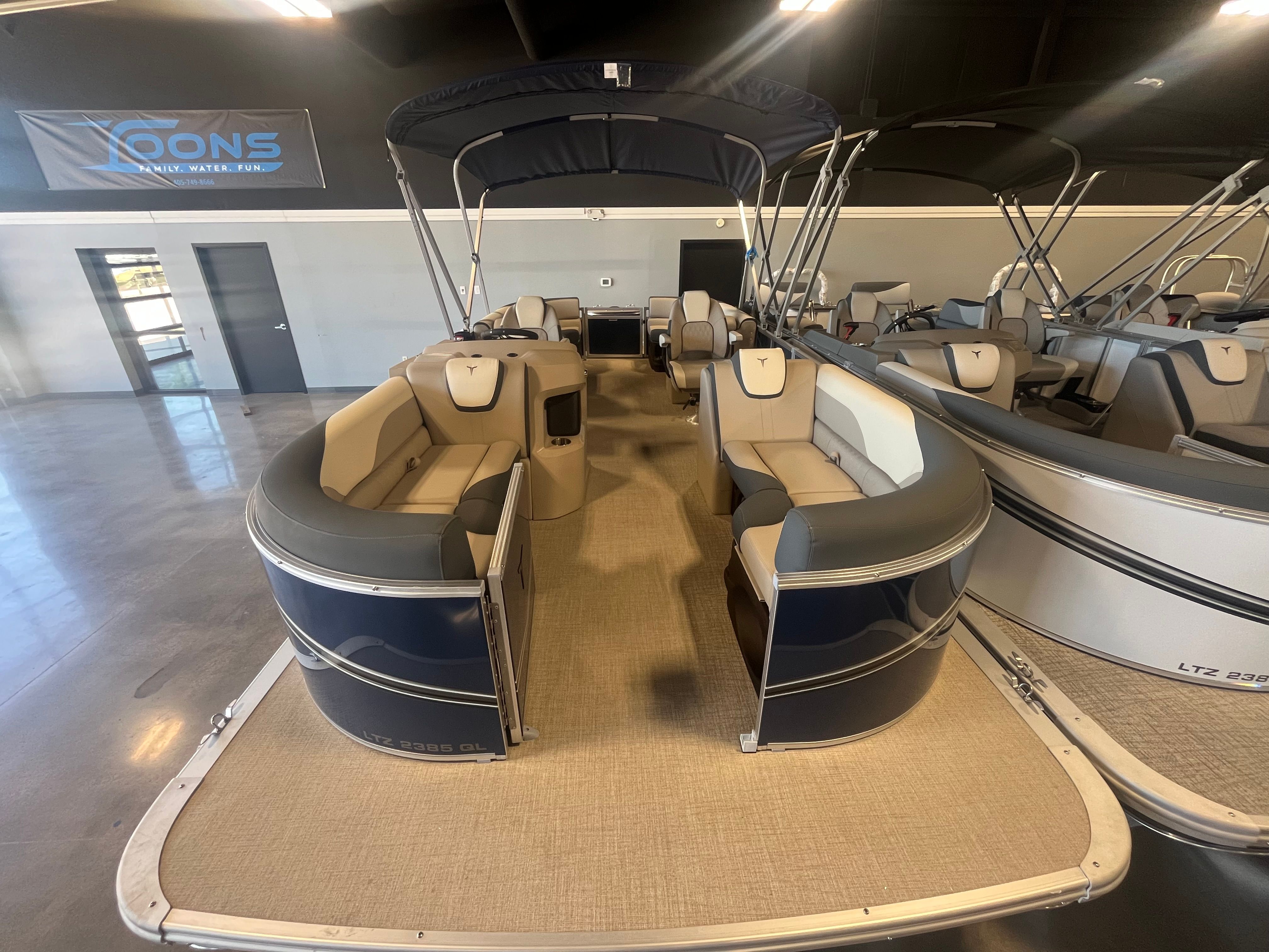 2025 Tahoe LTZ QL pontoon boat in showroom.