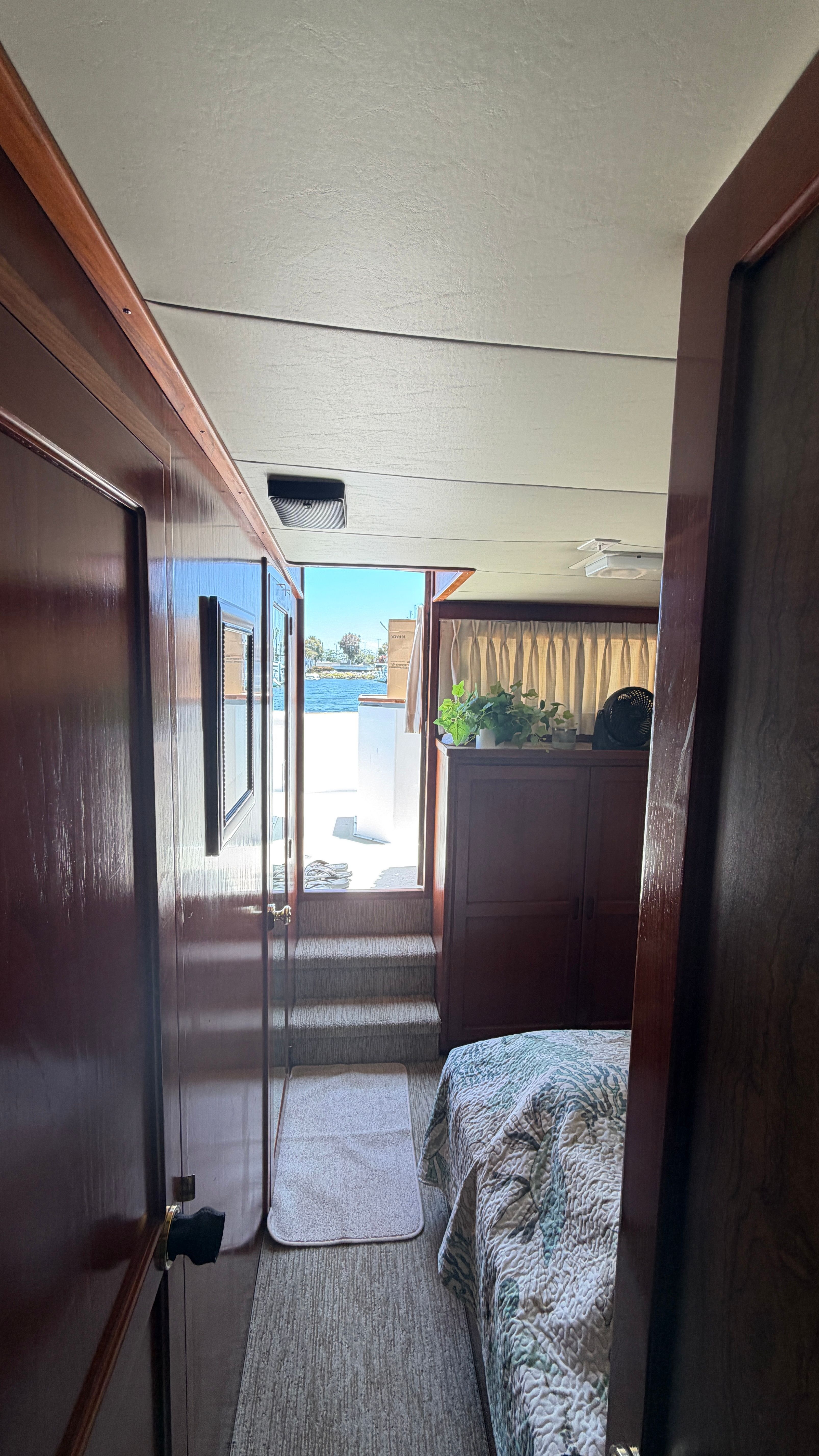 Interior of a 1966 Drake Yachtfisher with a view of the water.