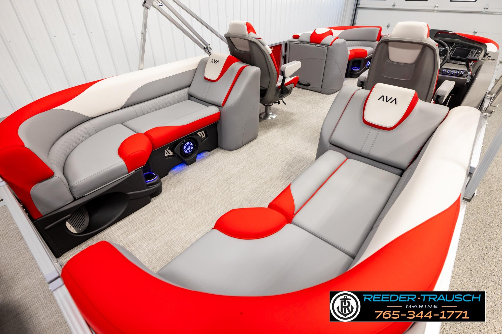 Luxurious interior of 2026 Avalon LSZ QL pontoon boat with red and gray seating.