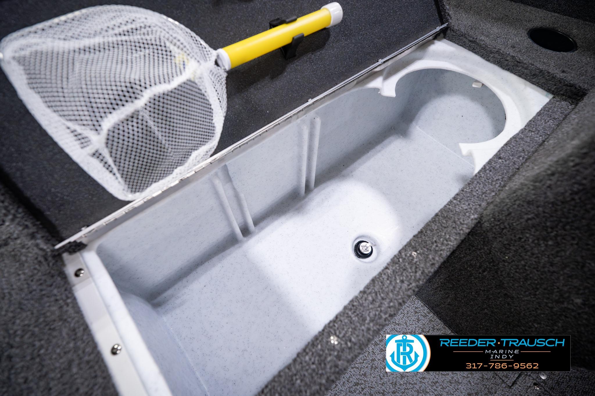 Interior storage compartment of 2026 Lund 1650 Rebel XL SS boat with fishing net.