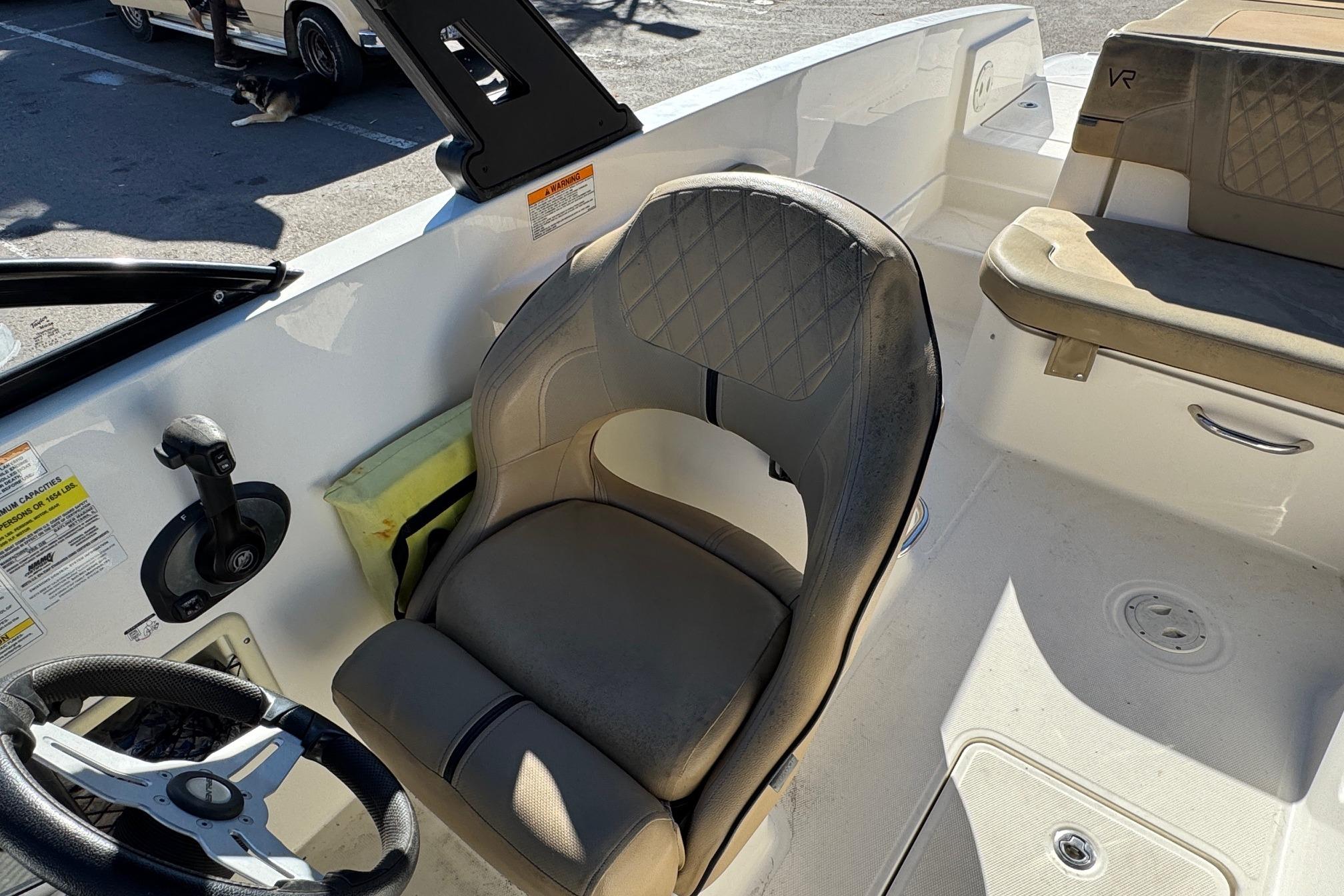 2022 Bayliner VR6 Bowrider OB interior with steering wheel and seating.