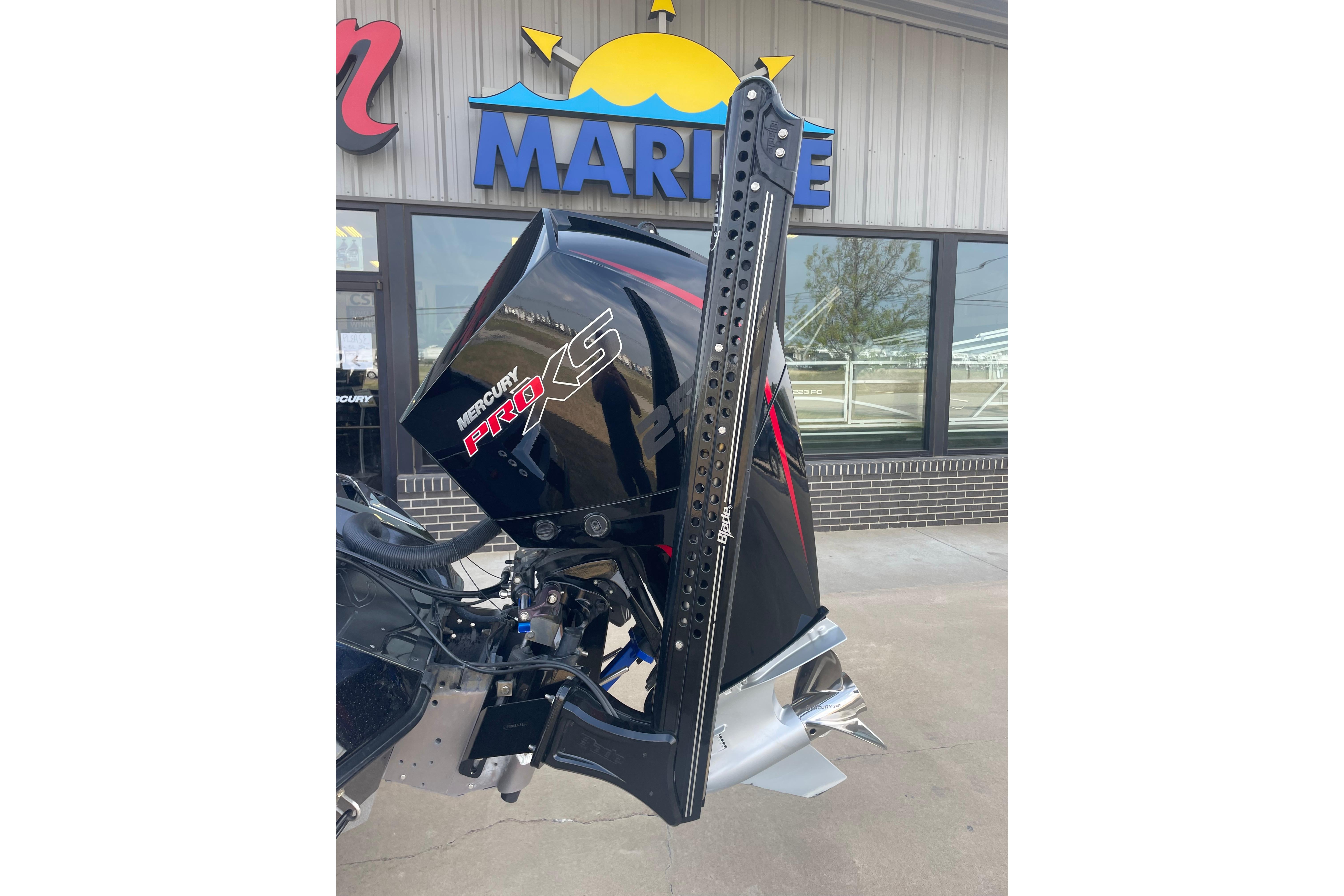 2023 Ranger Z521R boat with Mercury Pro XS engine at a marine dealership.