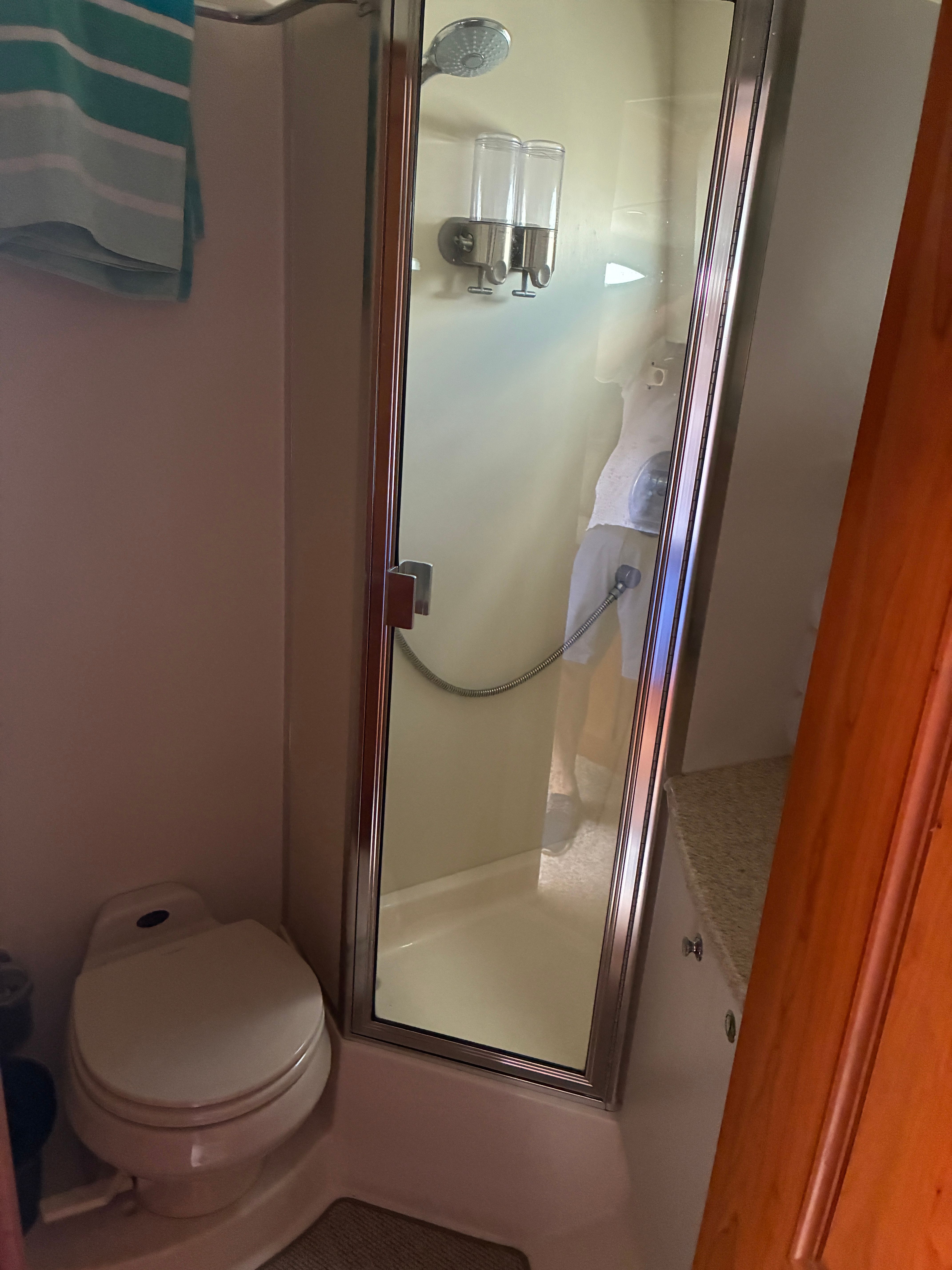 Bathroom with shower and toilet in a yacht.