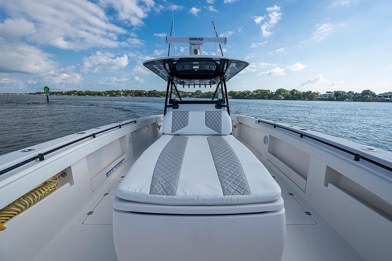 2018 Invincible 40 Catamaran on water, featuring spacious deck and luxurious seating.