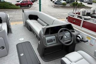 2026 Sun Tracker Party Barge 22 XP3 interior with steering console and seating.