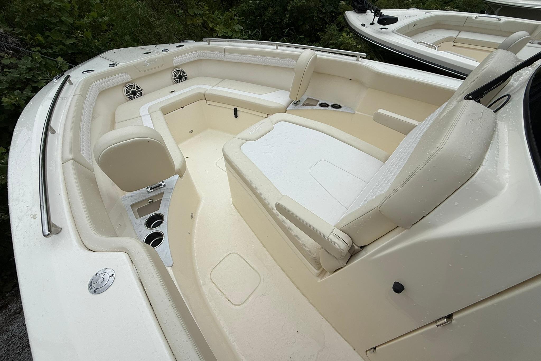 2026 Scout 260 LXF boat interior with beige seating and cup holders.