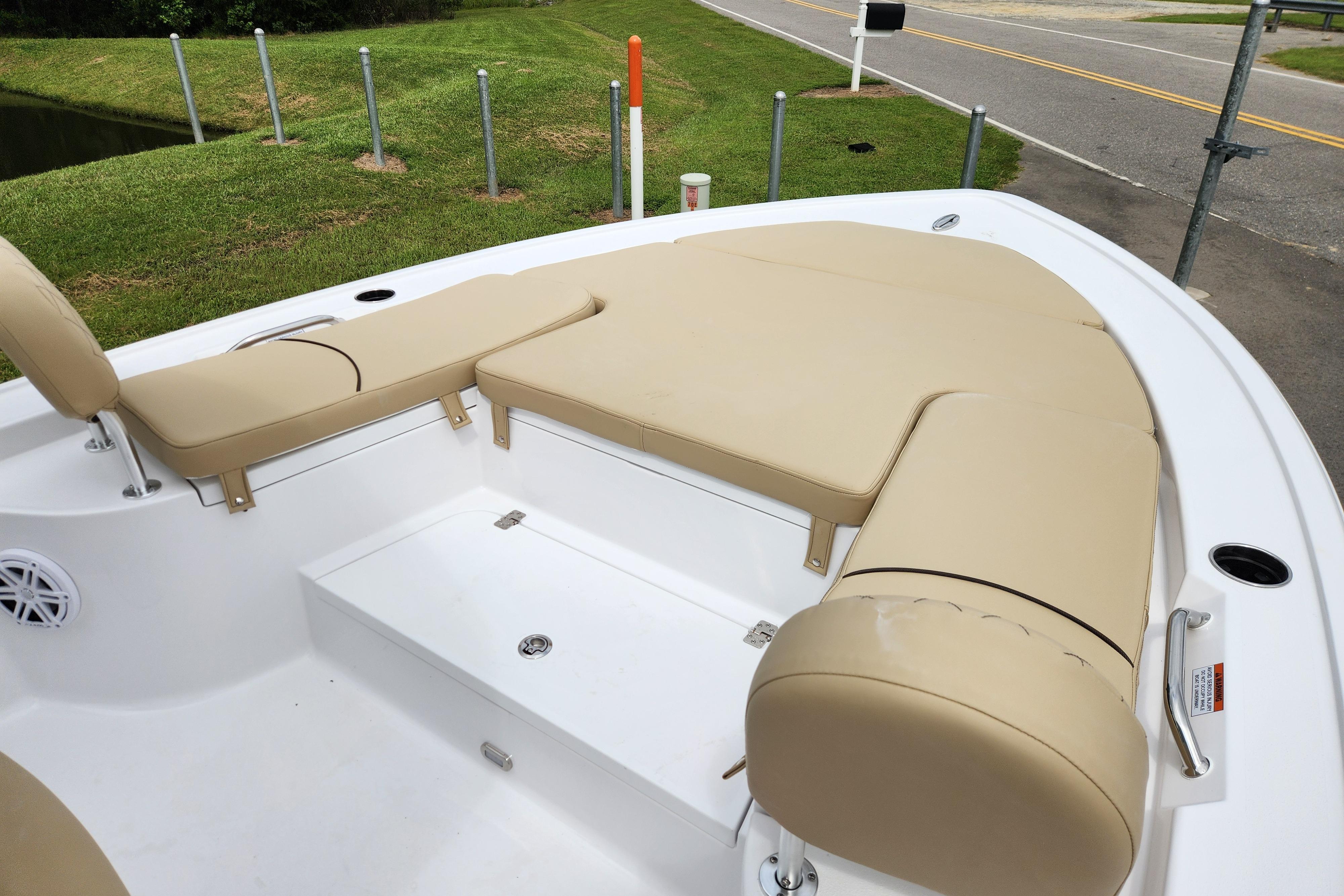 2026 Sportsman Masters 247 Bay Boat with beige cushioned seating and spacious deck layout.